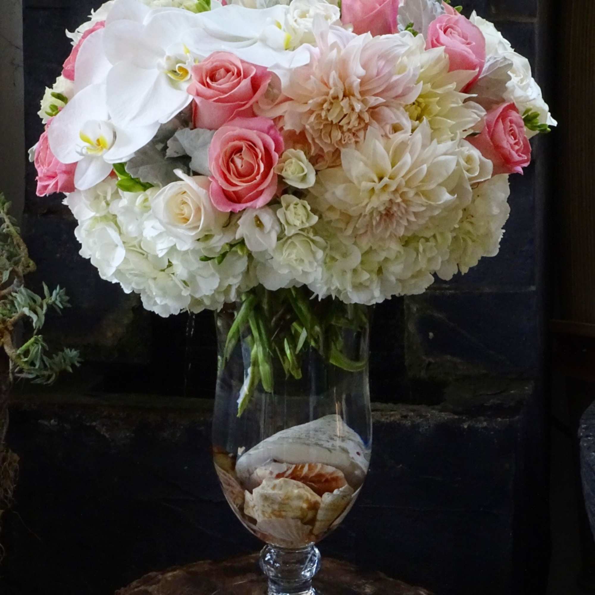 Premium Roses, Orchid, Hydrangea, and ....in glass vase design by sea shells