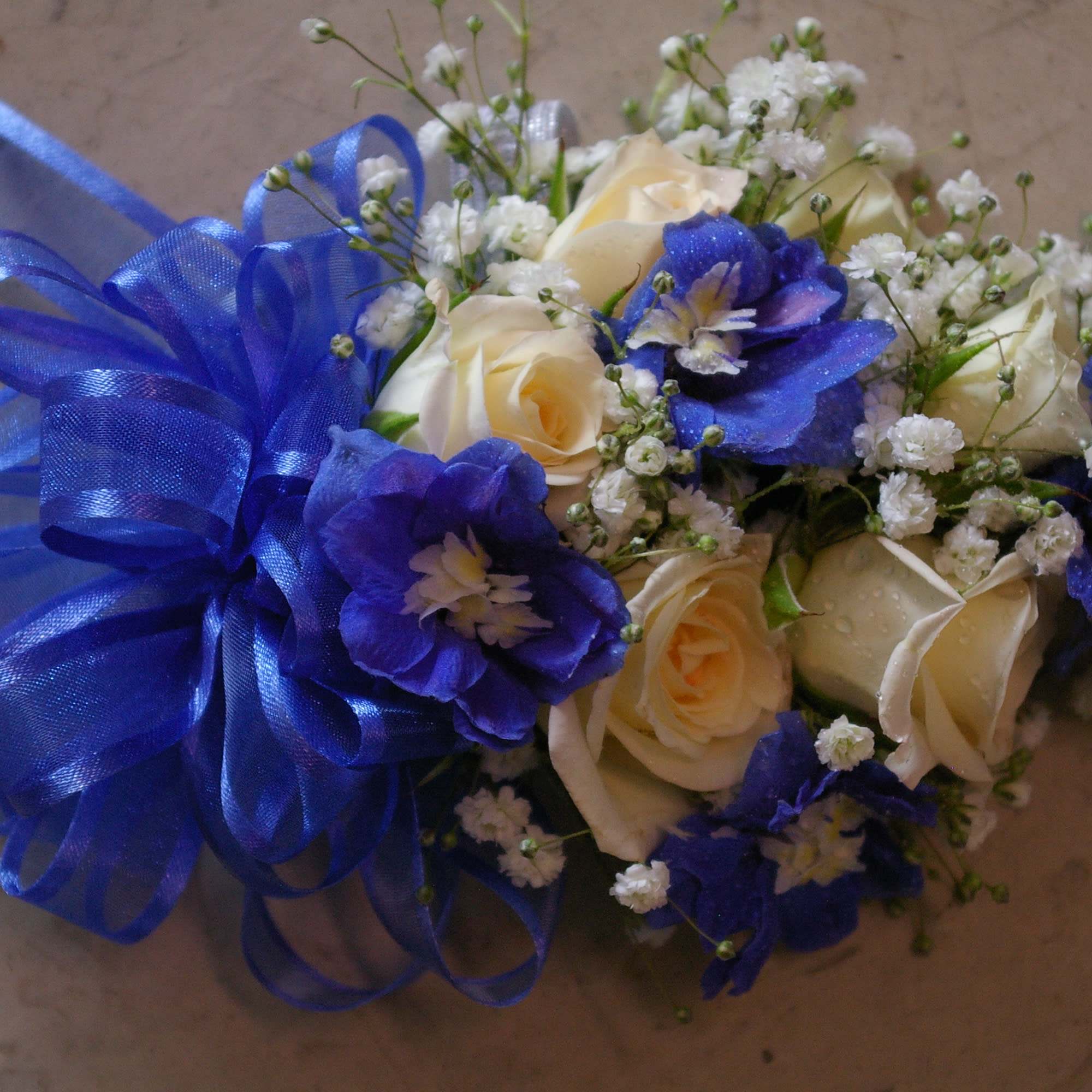 light pink  roses with colorful miniature flowers
