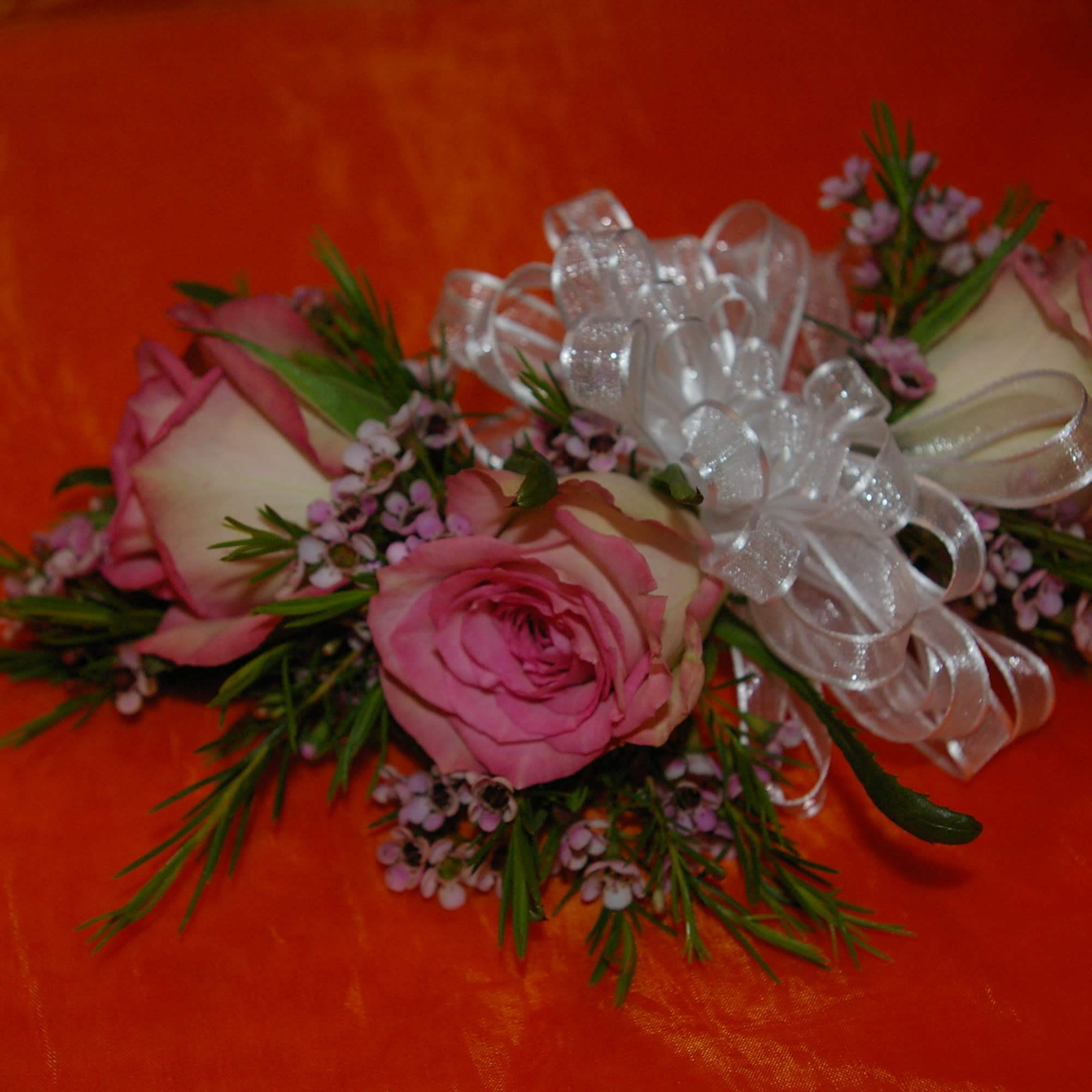 light pink  roses with colorful miniature flowers