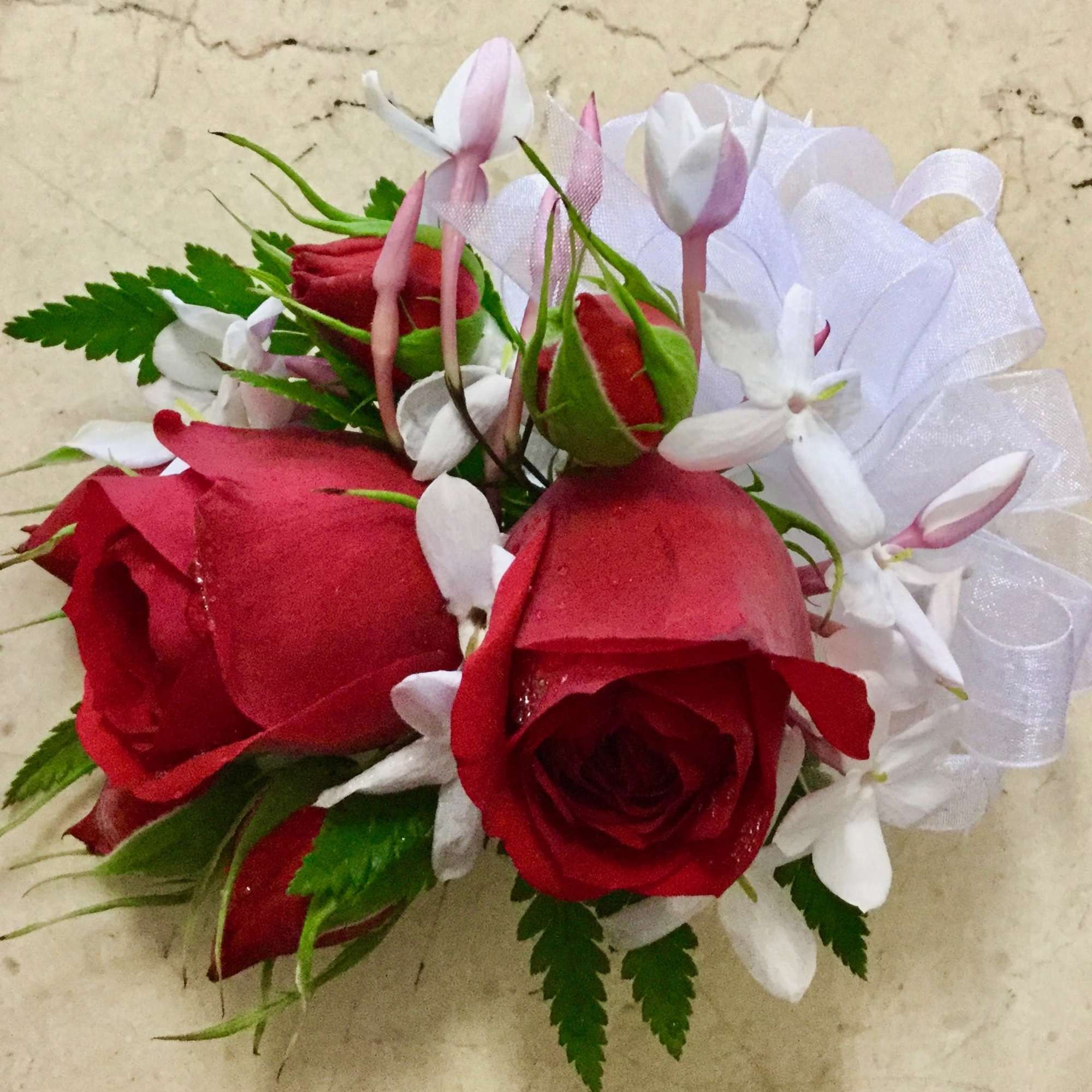 light pink  roses with colorful miniature flowers