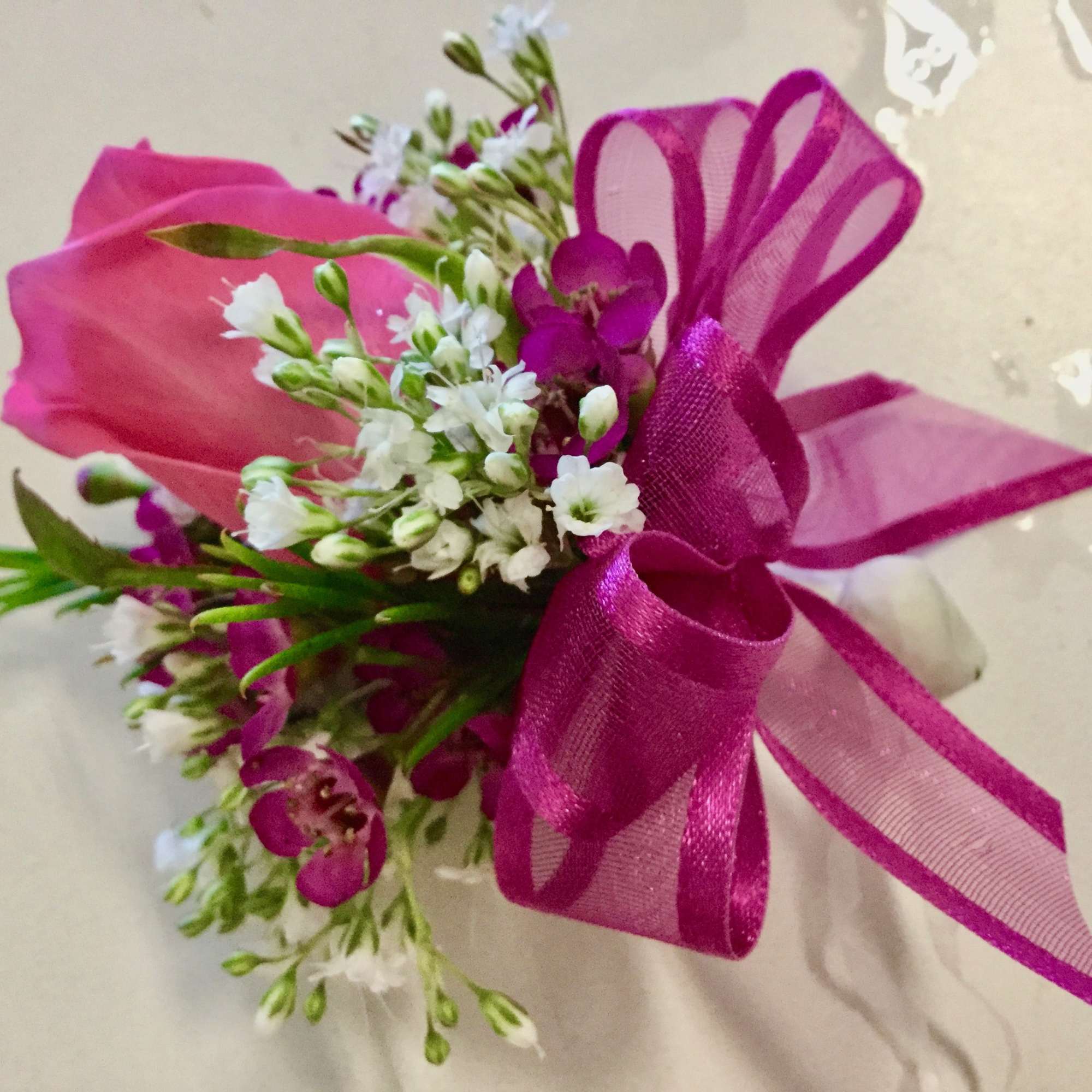 light pink  roses with colorful miniature flowers