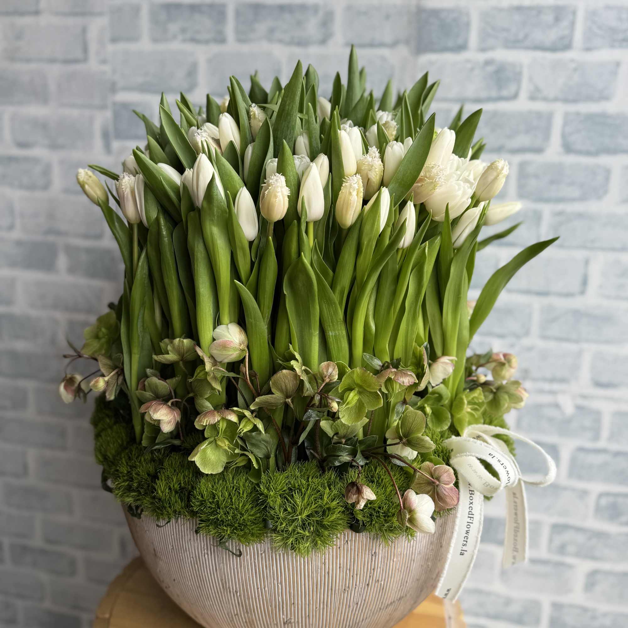 145 white beautiful tulips arranged in a stunning arrangement.  145 white beautiful tulips arranged in a stunning arrangement.