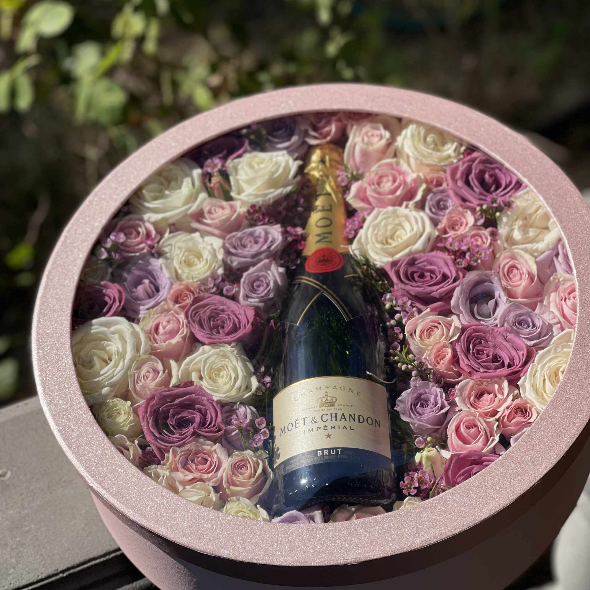 Full size Moët champagne accompanied with a combination of pink, lavender and Full size Moët champagne accompanied with a combination of pink, lavender and
