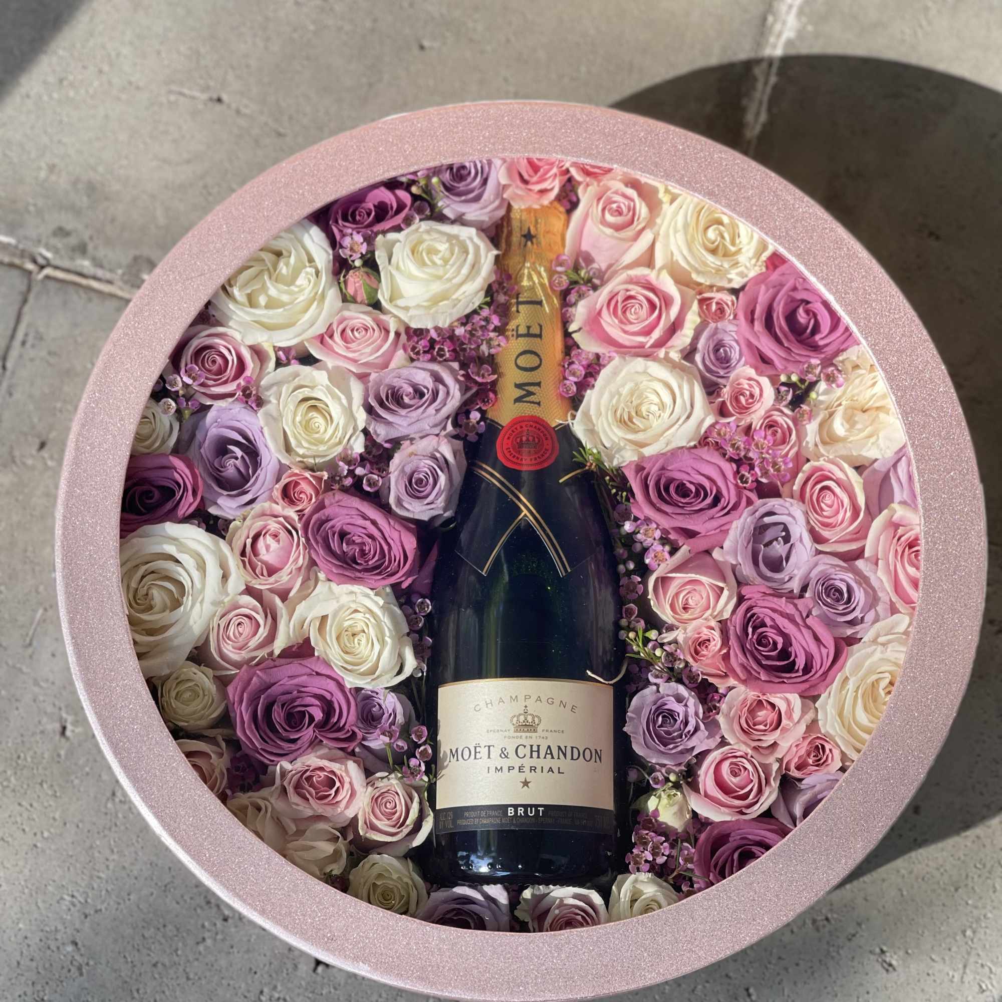 Full size Moët champagne accompanied with a combination of pink, lavender and Full size Moët champagne accompanied with a combination of pink, lavender and