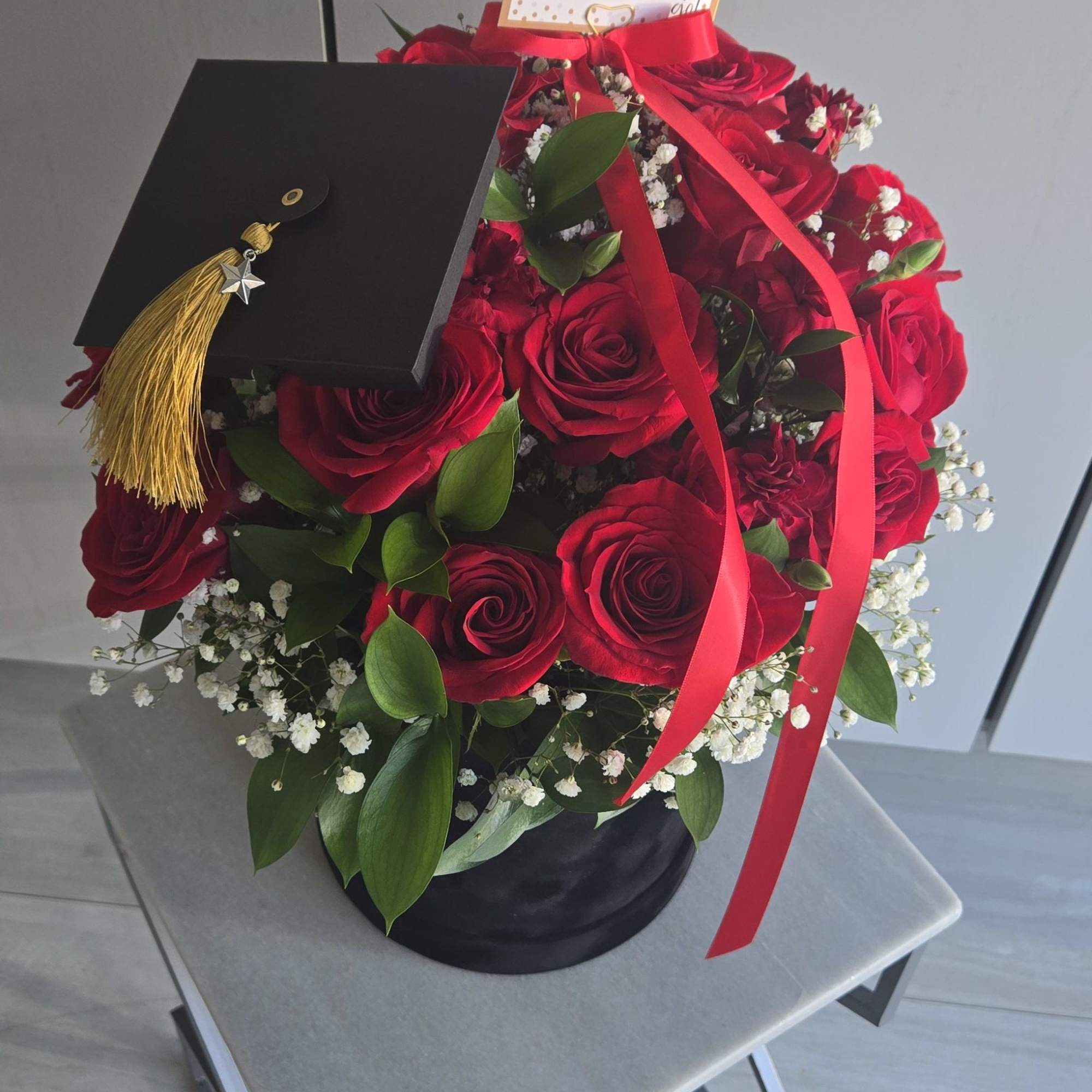 &quot;Celebrate success in style with this elegant floral arrangement. Featuring lush red