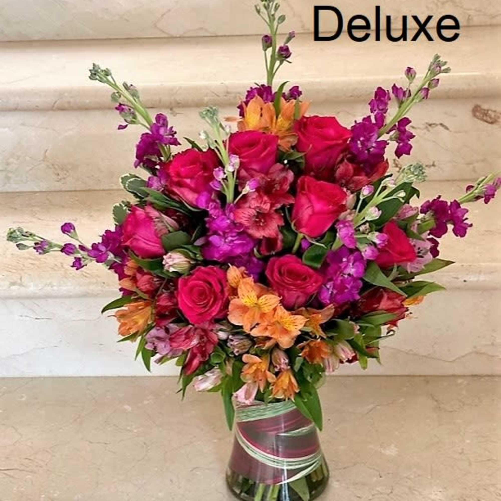 Mix of flowers arranged in a vase.
