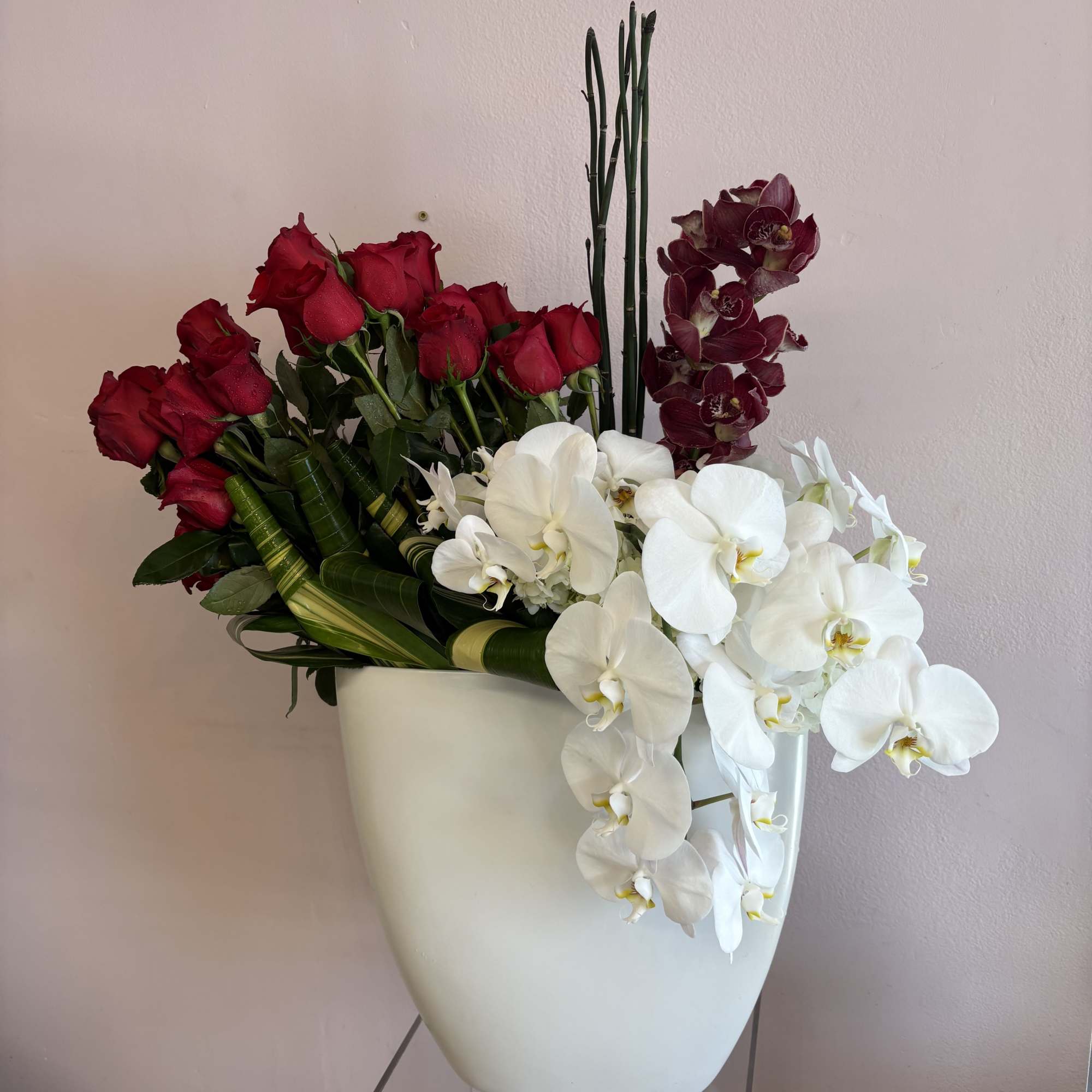 3 Dozen red roses, red cymbidium orchids, white phalaenopsis orchids accent with