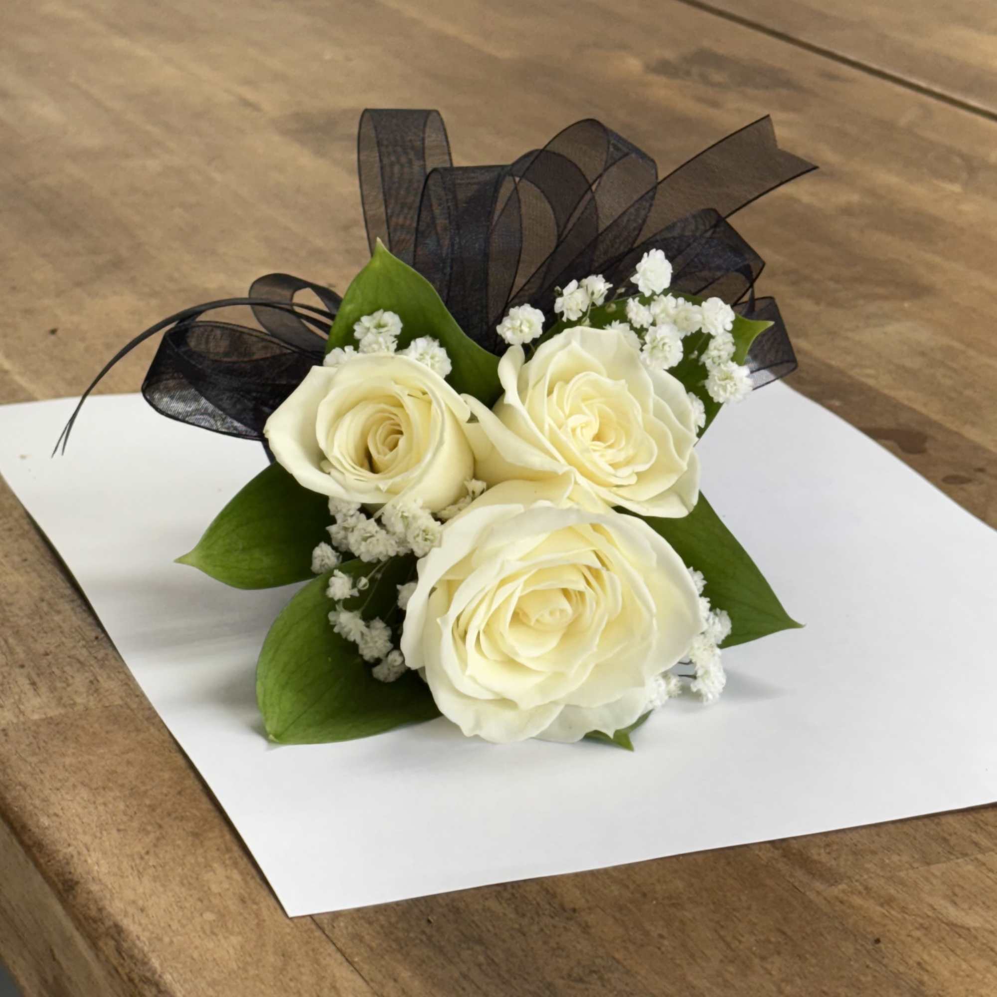 Elegant wrist corsages handcrafted with premium roses and lush foliage. Ideal for