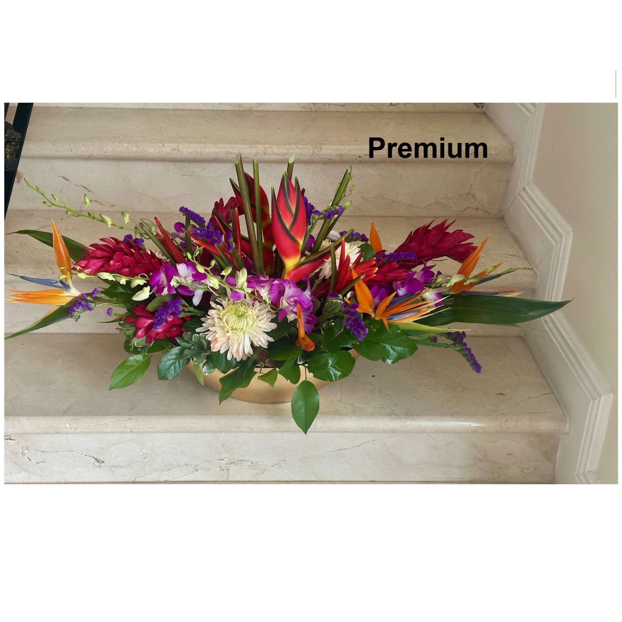 Tropical flowers for a centerpiece arranged low. Ideal for an Event and Tropical flowers for a centerpiece arranged low. Ideal for an Event and