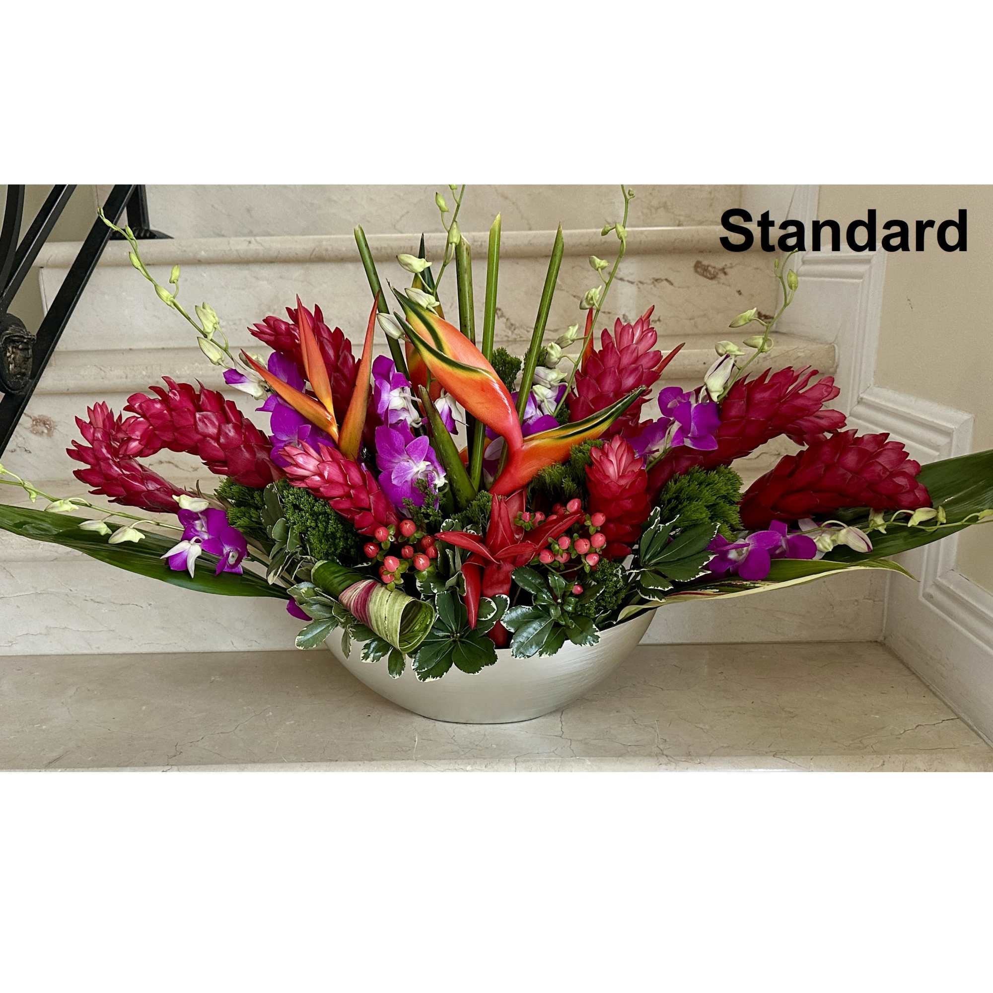Tropical flowers for a centerpiece arranged low. Ideal for an Event and Tropical flowers for a centerpiece arranged low. Ideal for an Event and