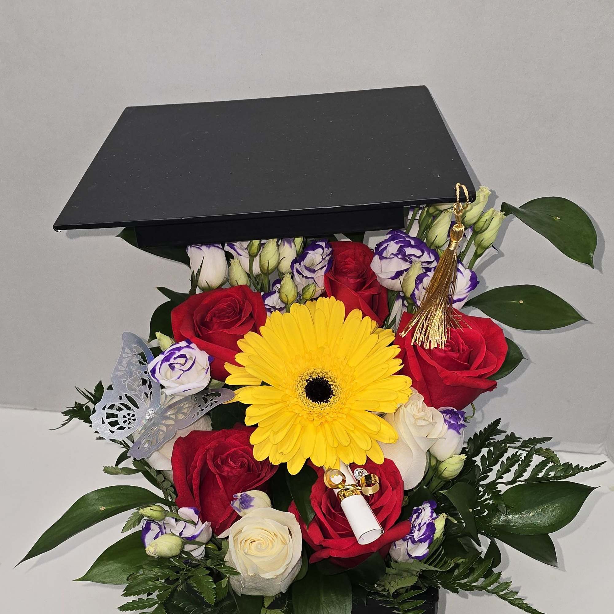 
A graduation bouquet is a celebratory floral arrangement, often used to congratulate