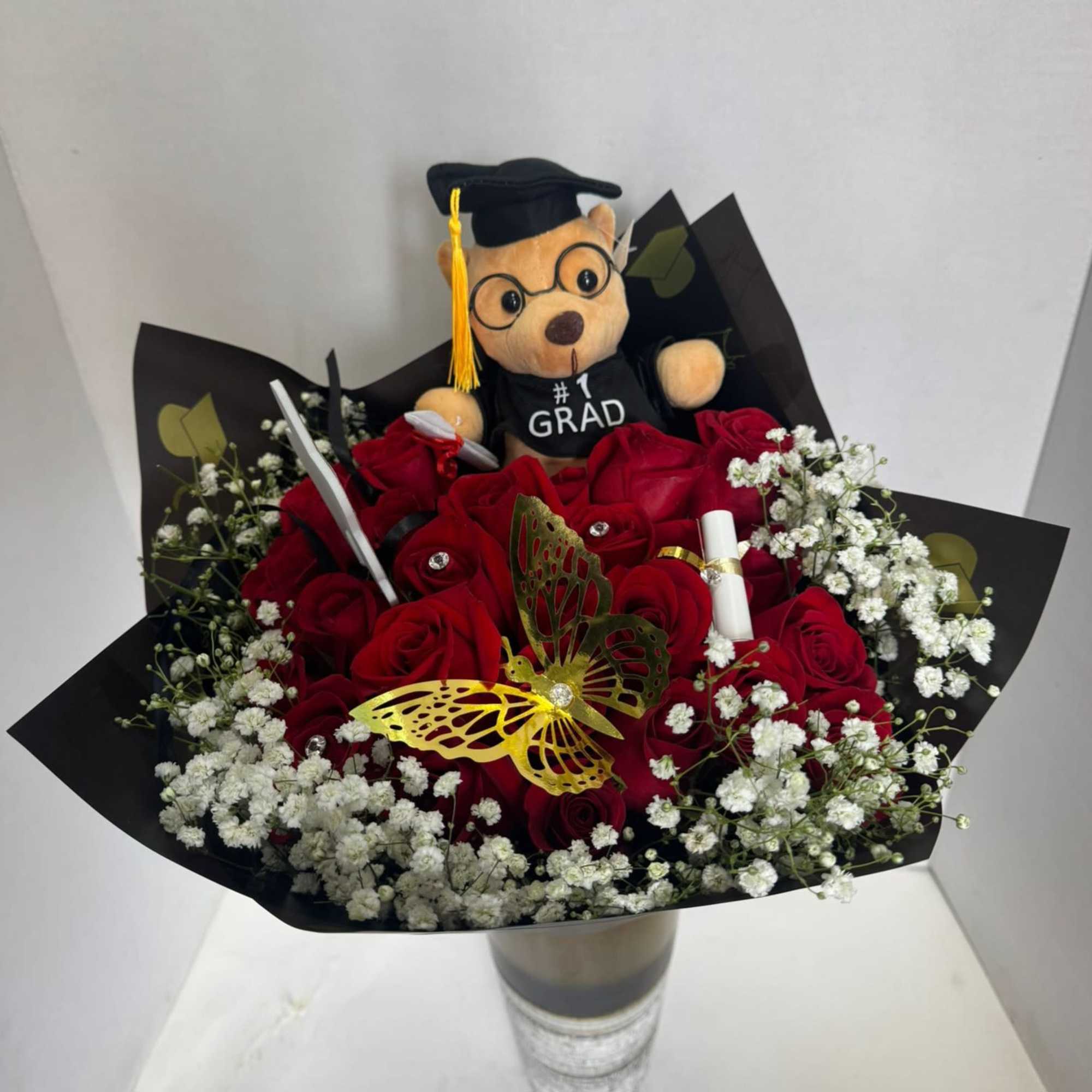 
A graduation bouquet is a celebratory floral arrangement, often used to congratulate