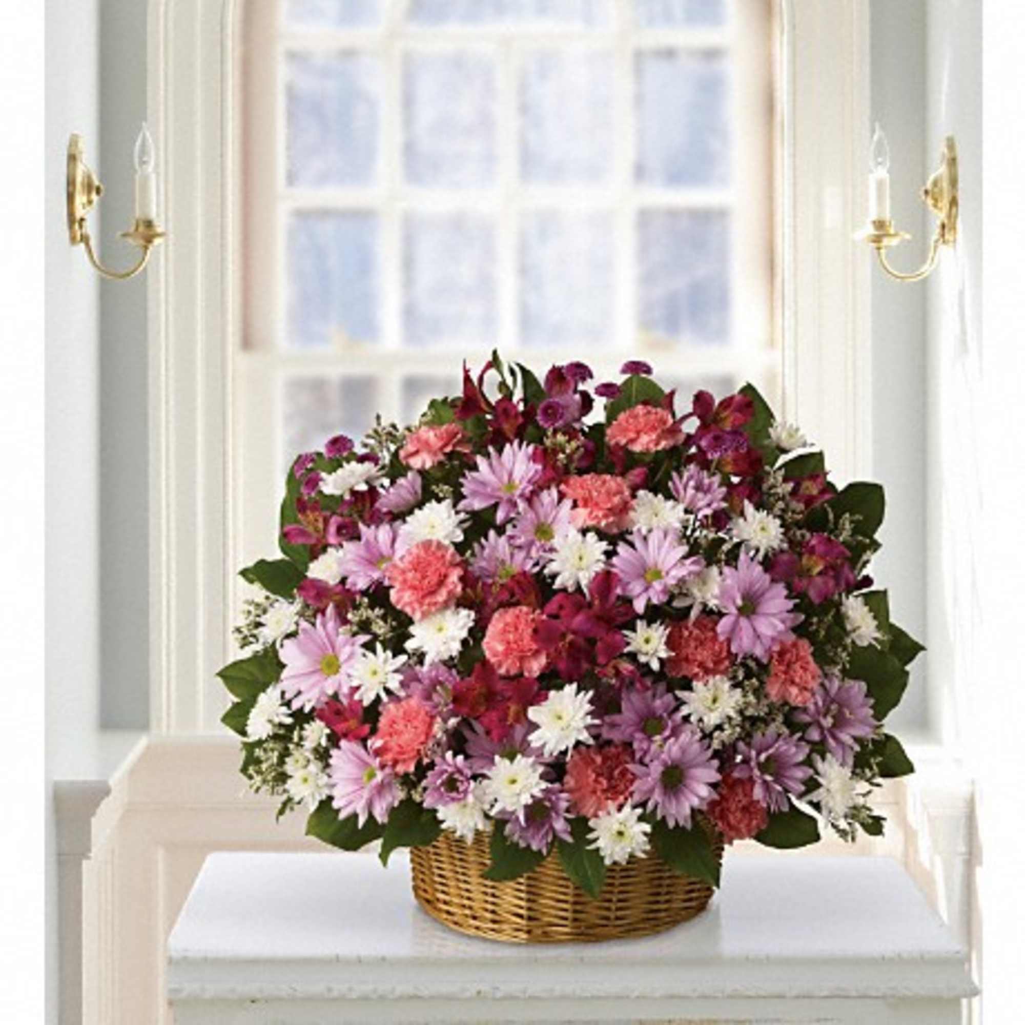 Soft and soothing. This basket is overflowing with pastel flowers and your