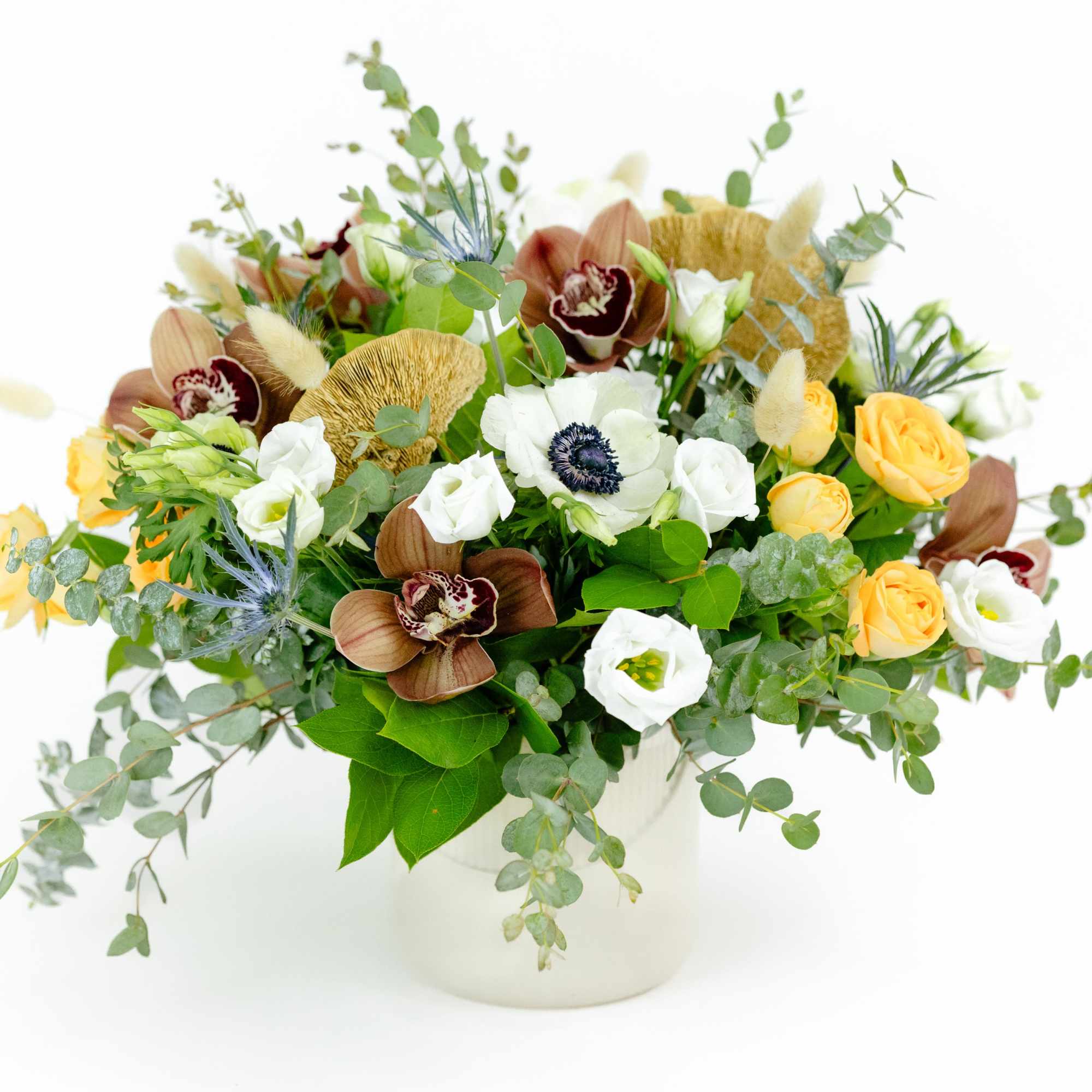 Wild, lush and romantic. This gorgeous arrangement of Anemones and Mushrooms has