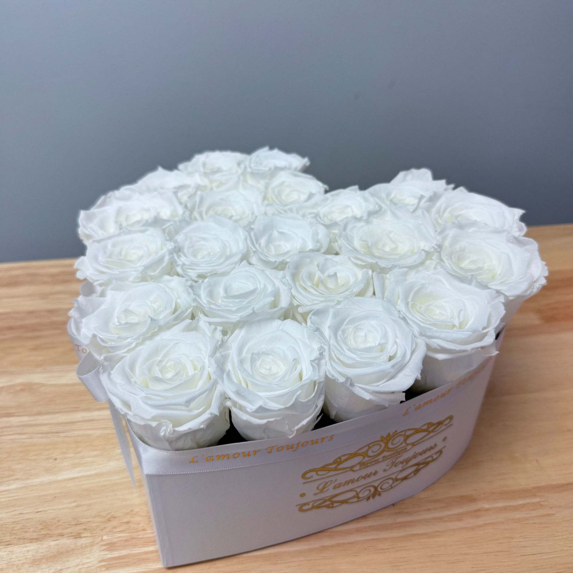 Premium Everlasting roses in our heart-shaped signature box. Everlasting roses are real