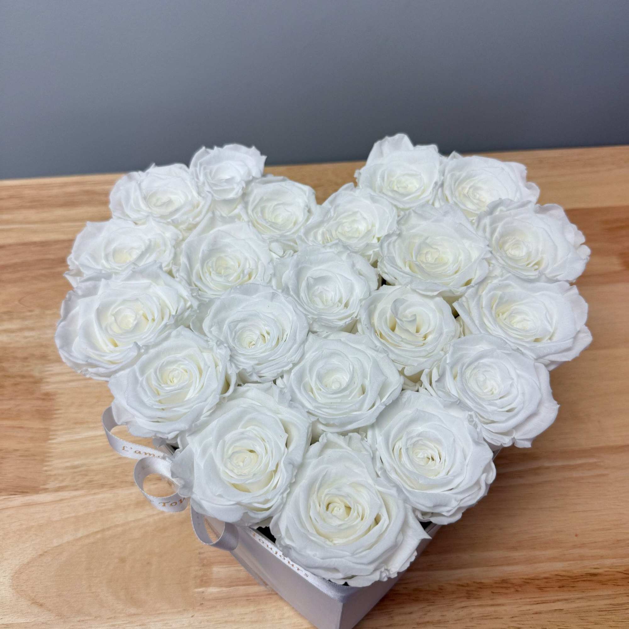 Premium Everlasting roses in our heart-shaped signature box. Everlasting roses are real