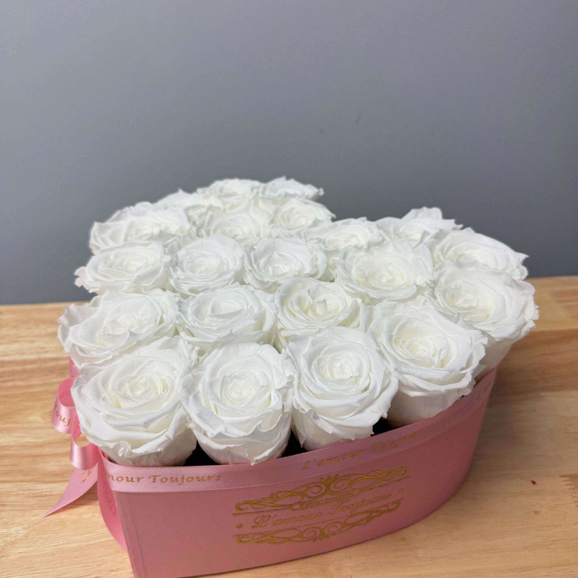 Premium Everlasting roses in our heart-shaped signature box. Everlasting roses are real