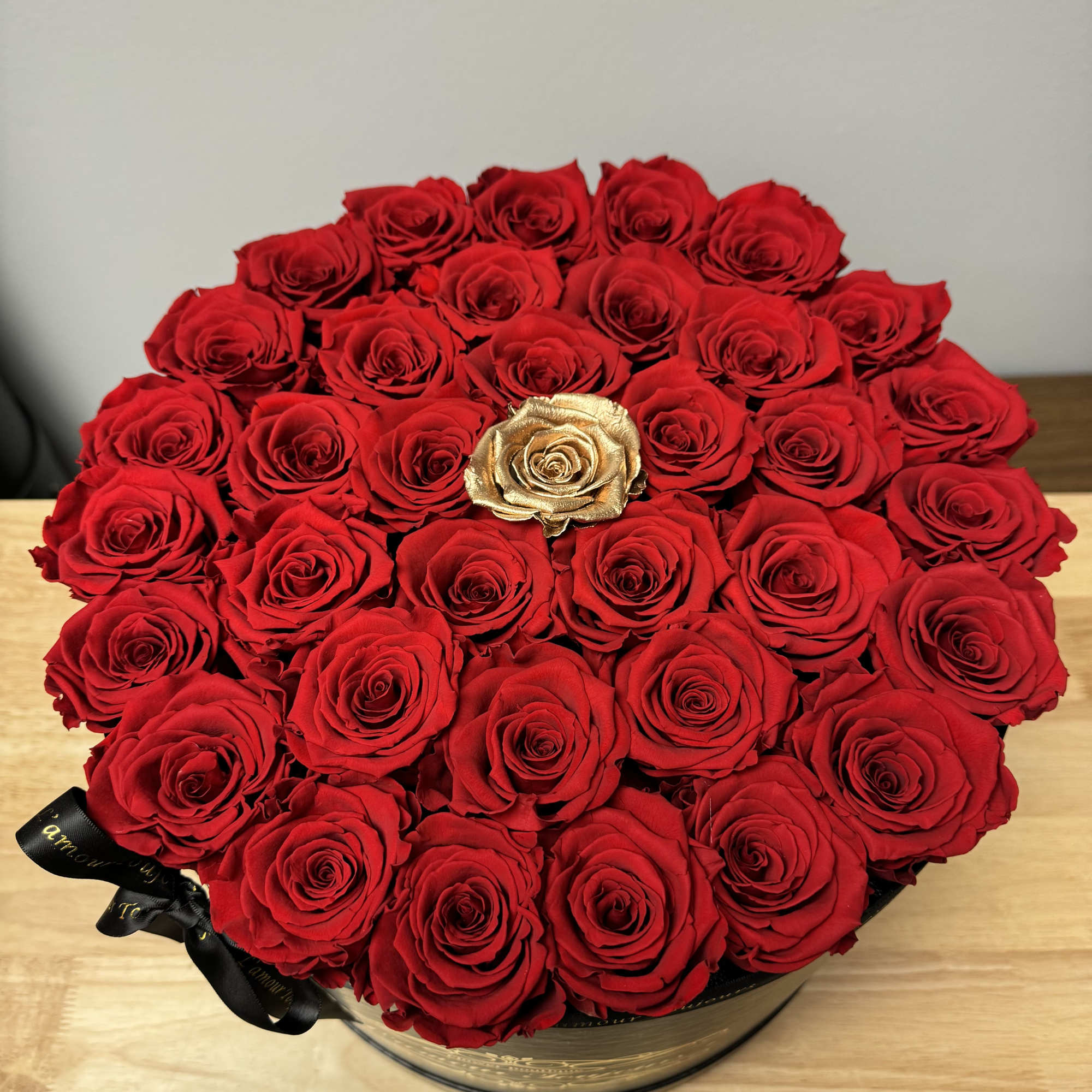 35 Everlasting roses with one gold in the middle. Everlasting roses are