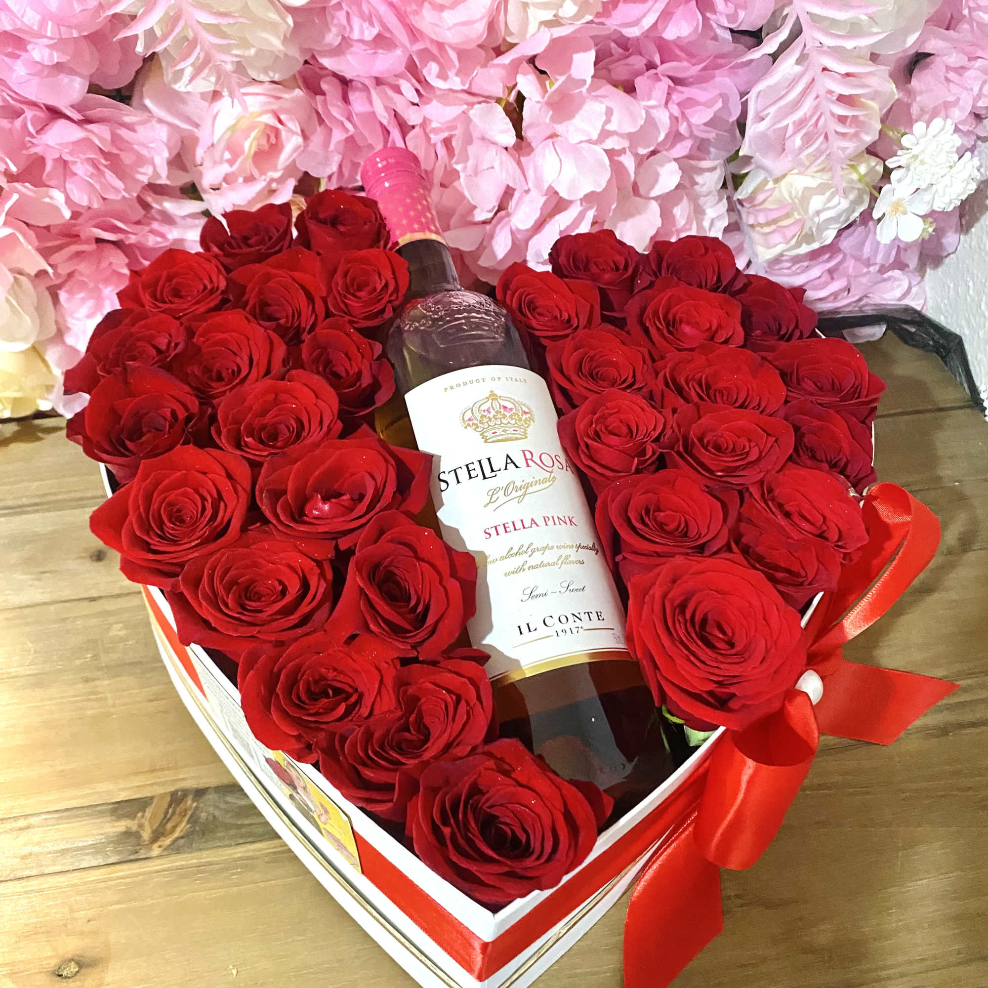 Brings 30-35 roses &amp; a bottle of stella rose wine, depending on