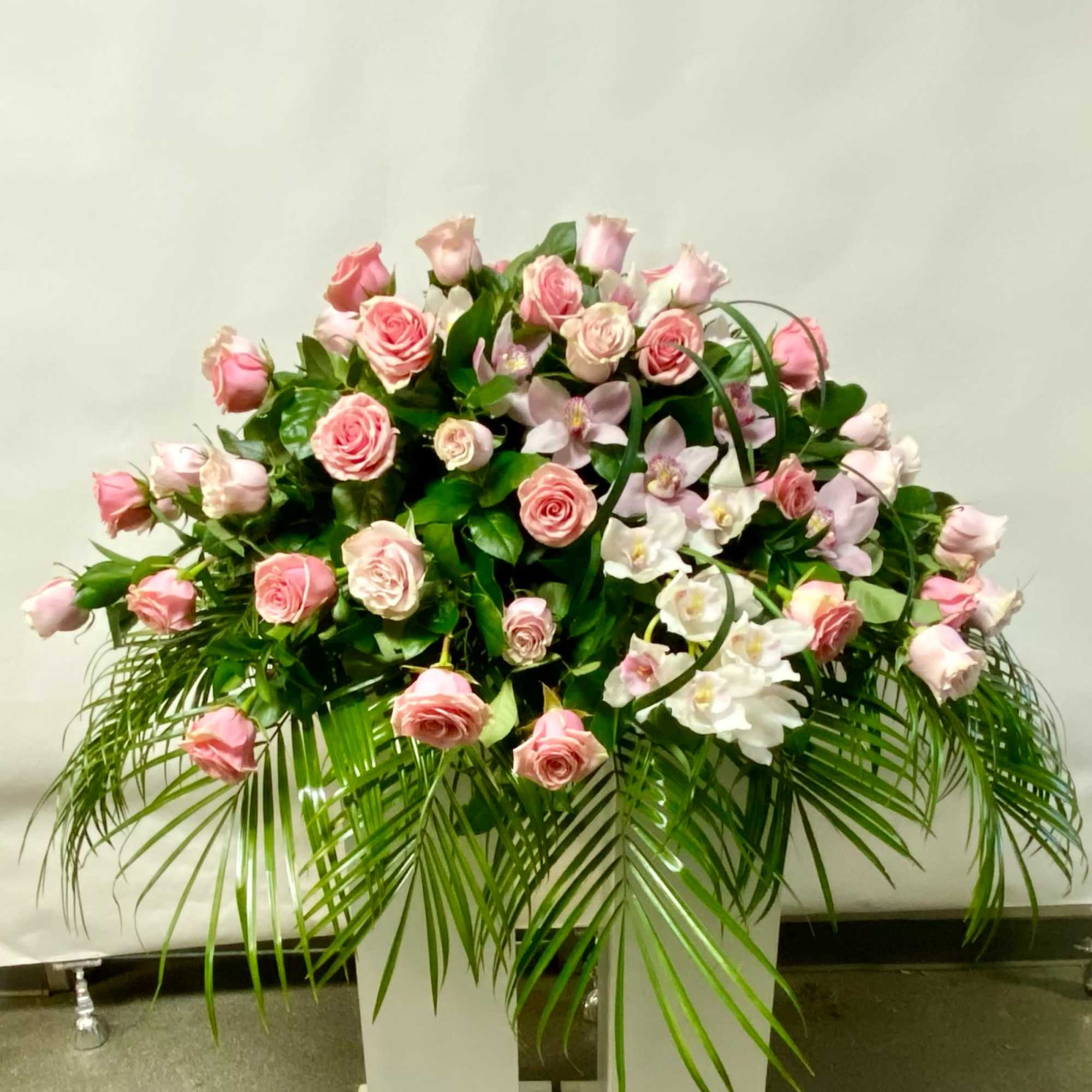 This Casket Spray Includes 3 Dozen Light Pink Roses with White or