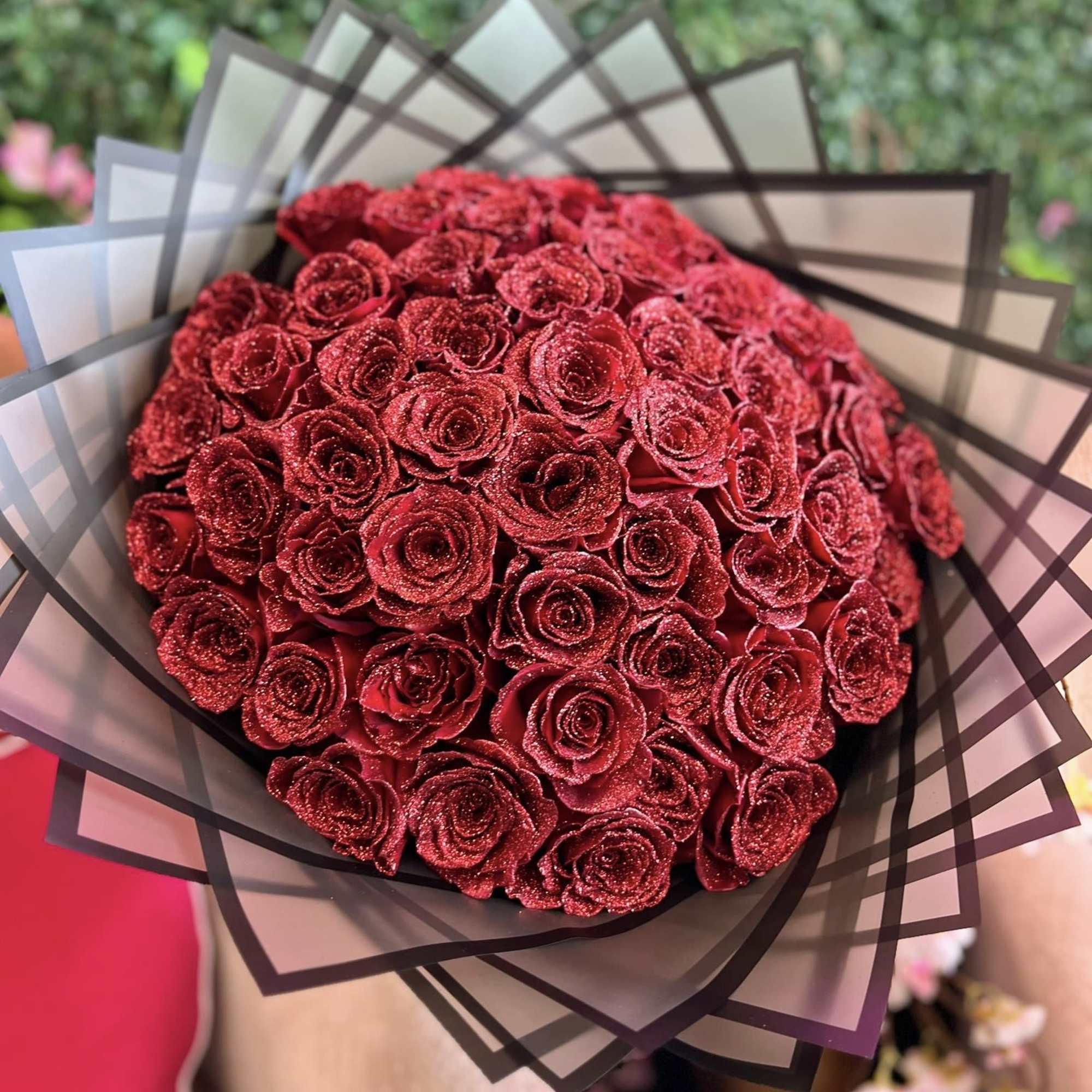 Glitter red rose bouquet is a captivating arrangement designed to exude romance