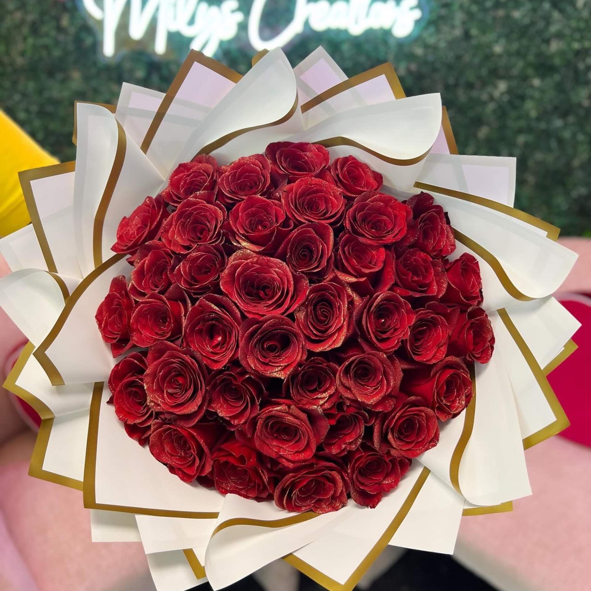 Roses enhanced with sparkles, metallic and gold accents, and other embellishments to