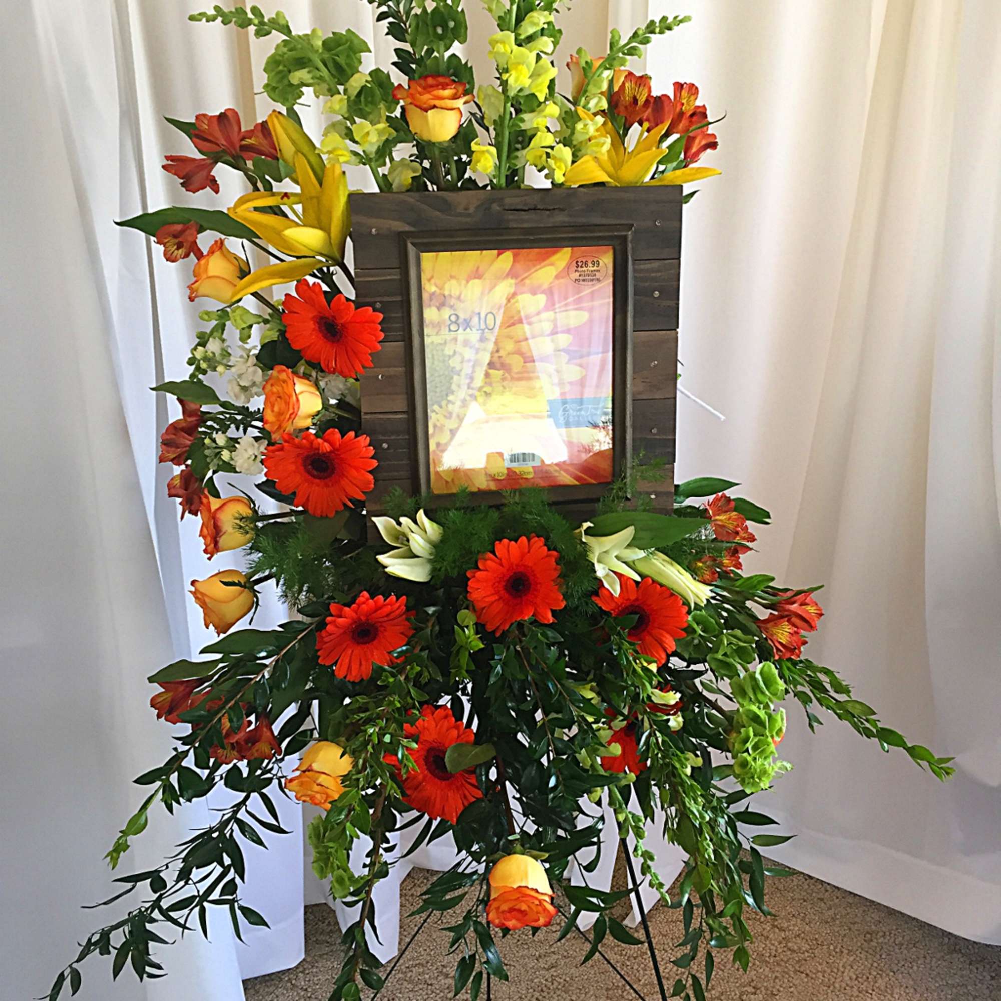 Sympathy spray featuring an 8&quot; x 10&quot; framed picture of your loved