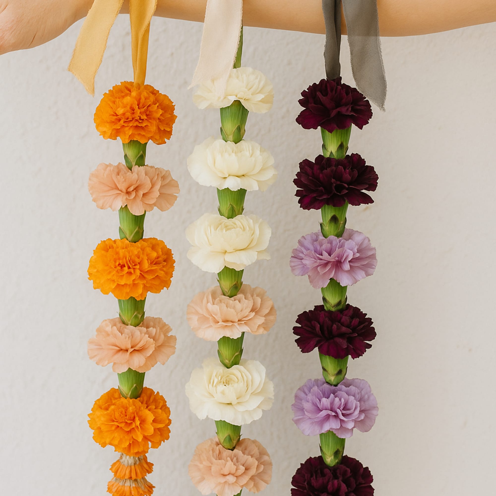 Woven by hand with fresh, seasonal blooms, our Flower Leis are a