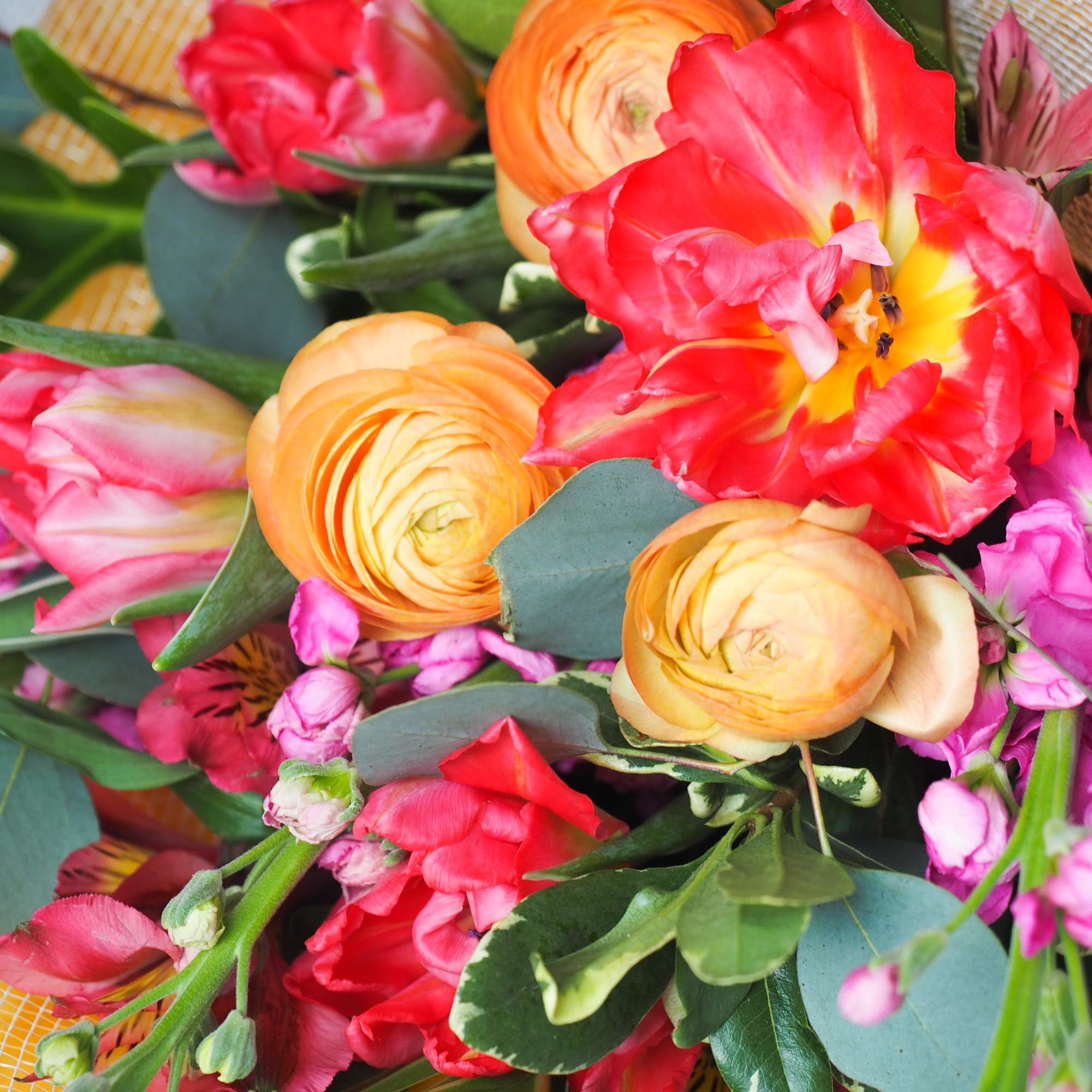 This hand-tied bouquet features a vibrant mix of blooms with special meanings.