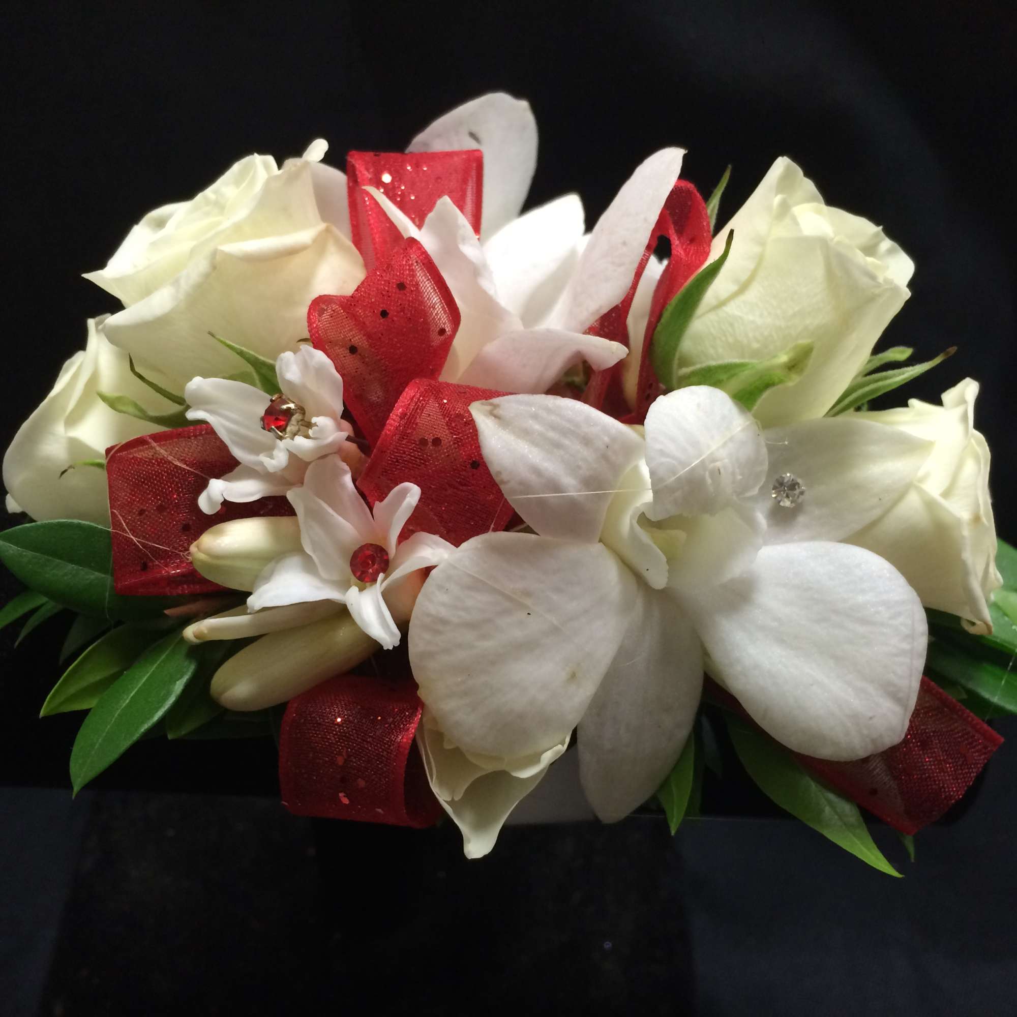 Our wrist corsages are made of orchids, roses, and other scented flowers