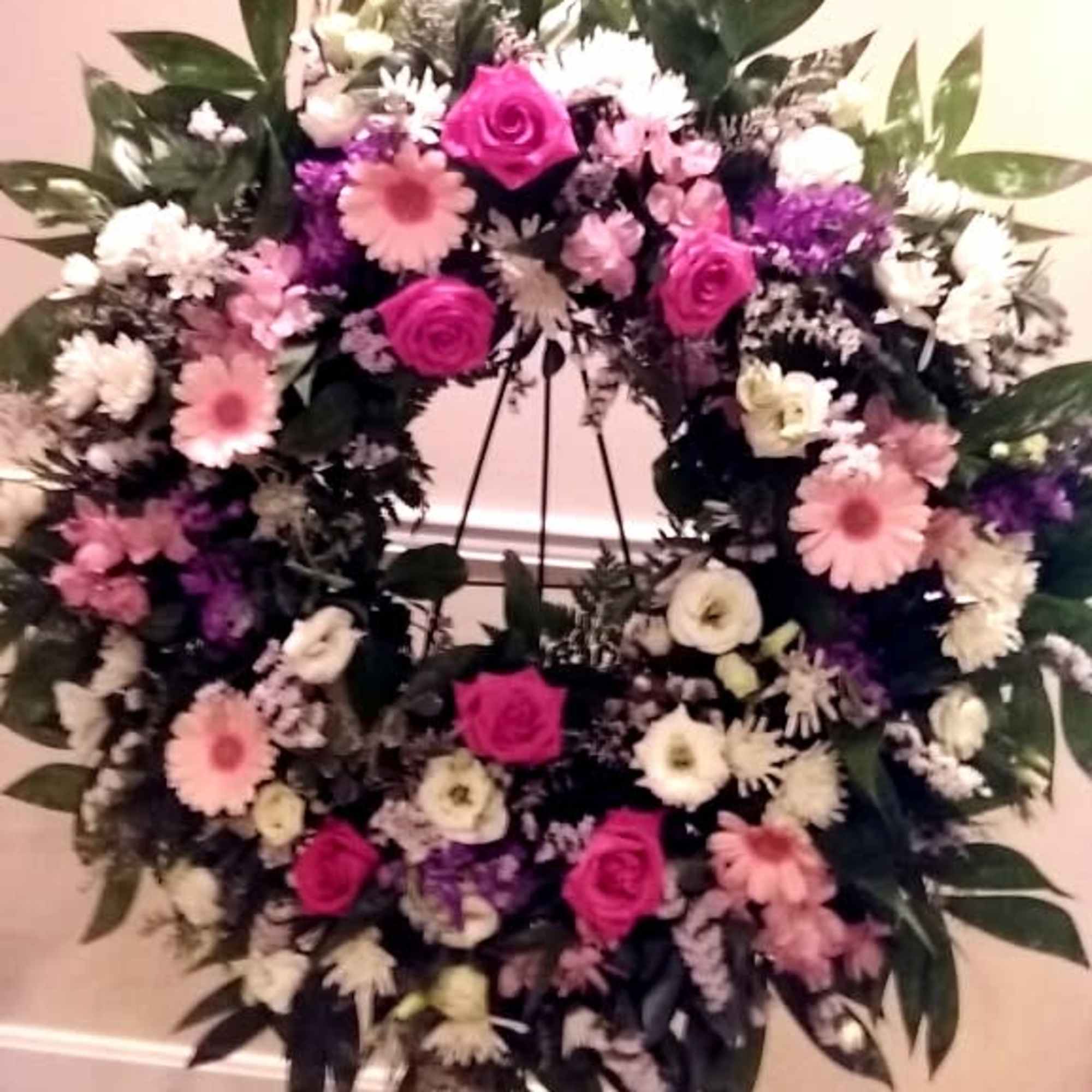 Send sincere thoughts and wishes with a large mixed wreath on a