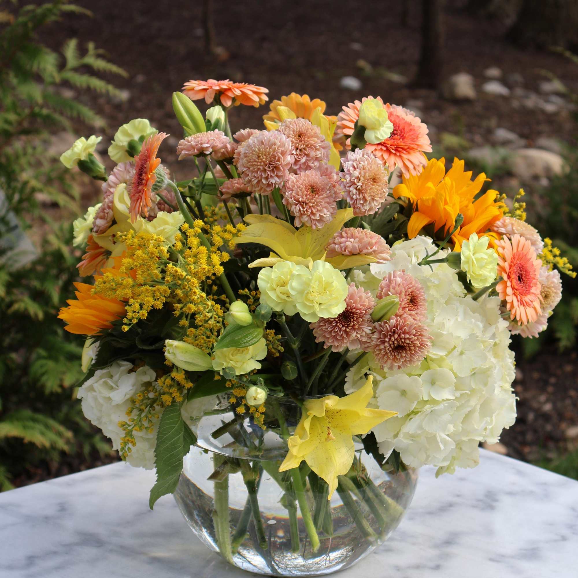 &ldquo;Golden Morning&rdquo; is a cheerful and lush floral arrangement that blends soft