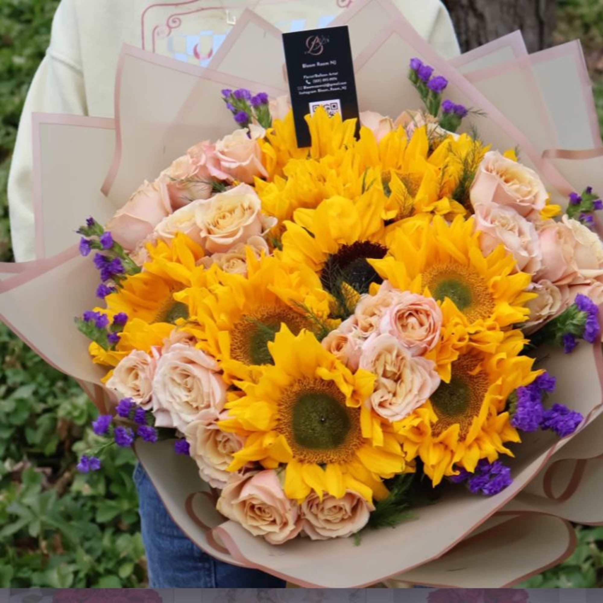 Bursting with the warmth of golden sunflowers, soft blush roses, and delicate