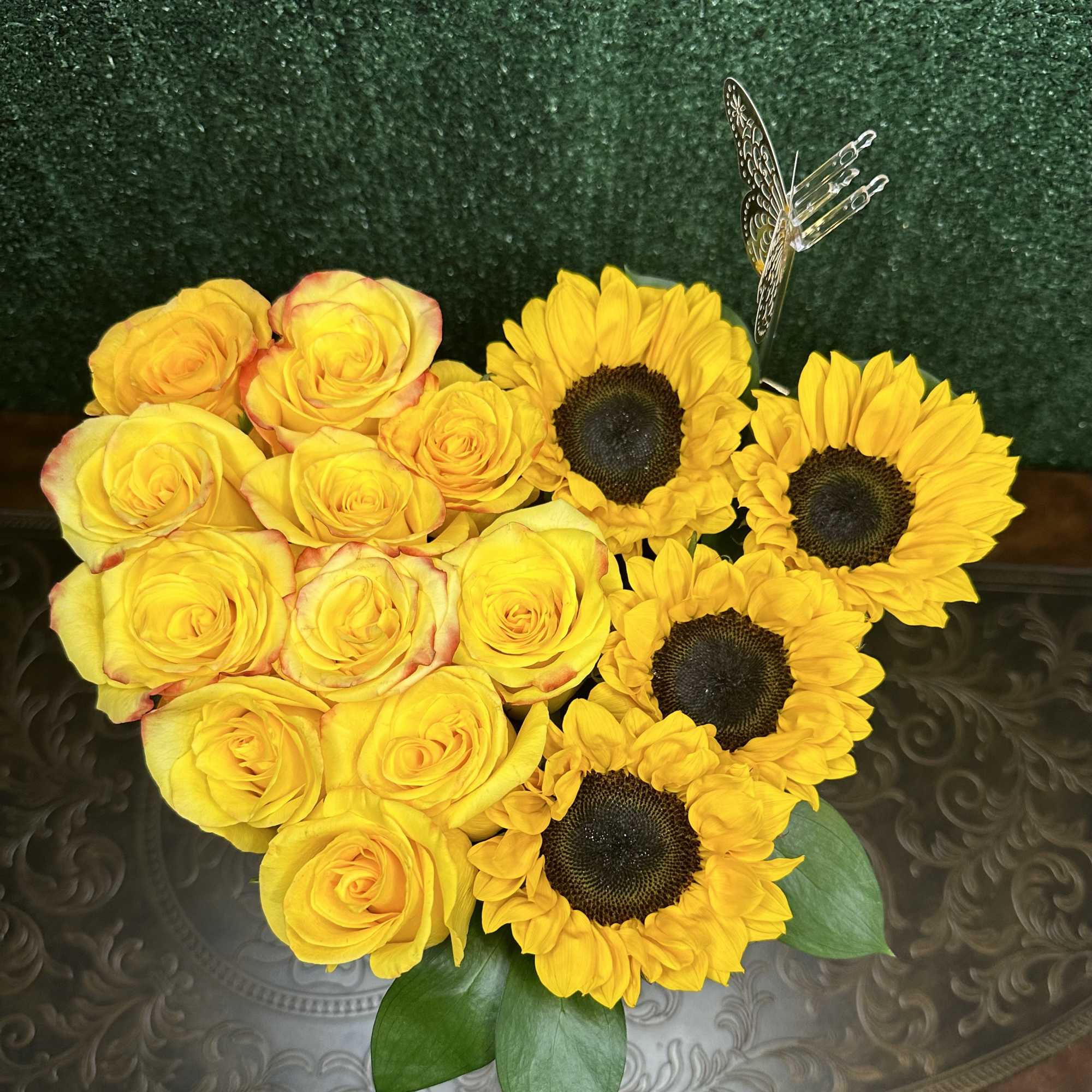 Roses and sunflowers on a heart shape box Roses and sunflowers on a heart shape box