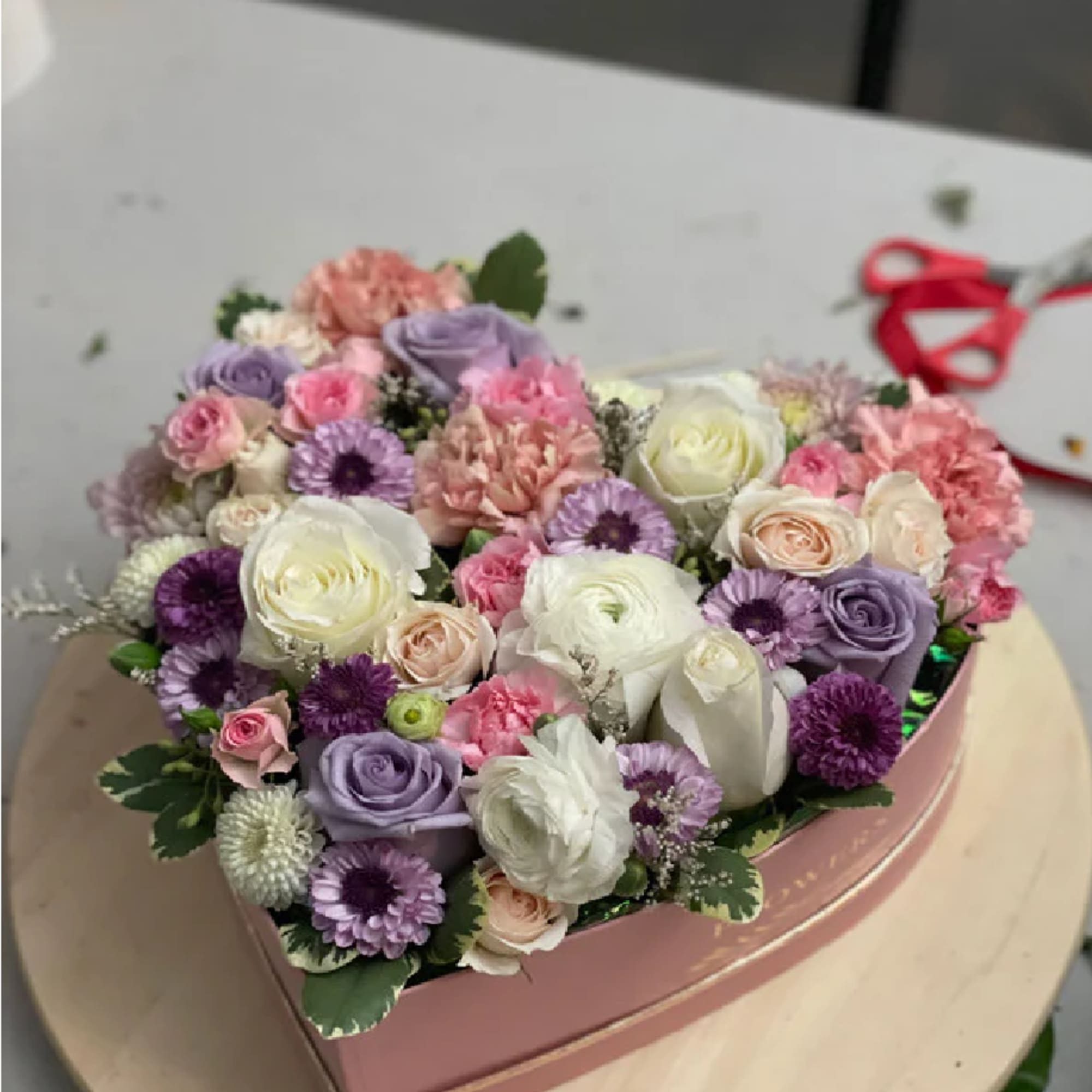 Arranged in a beautiful heart shaped box, the premium fresh cut large