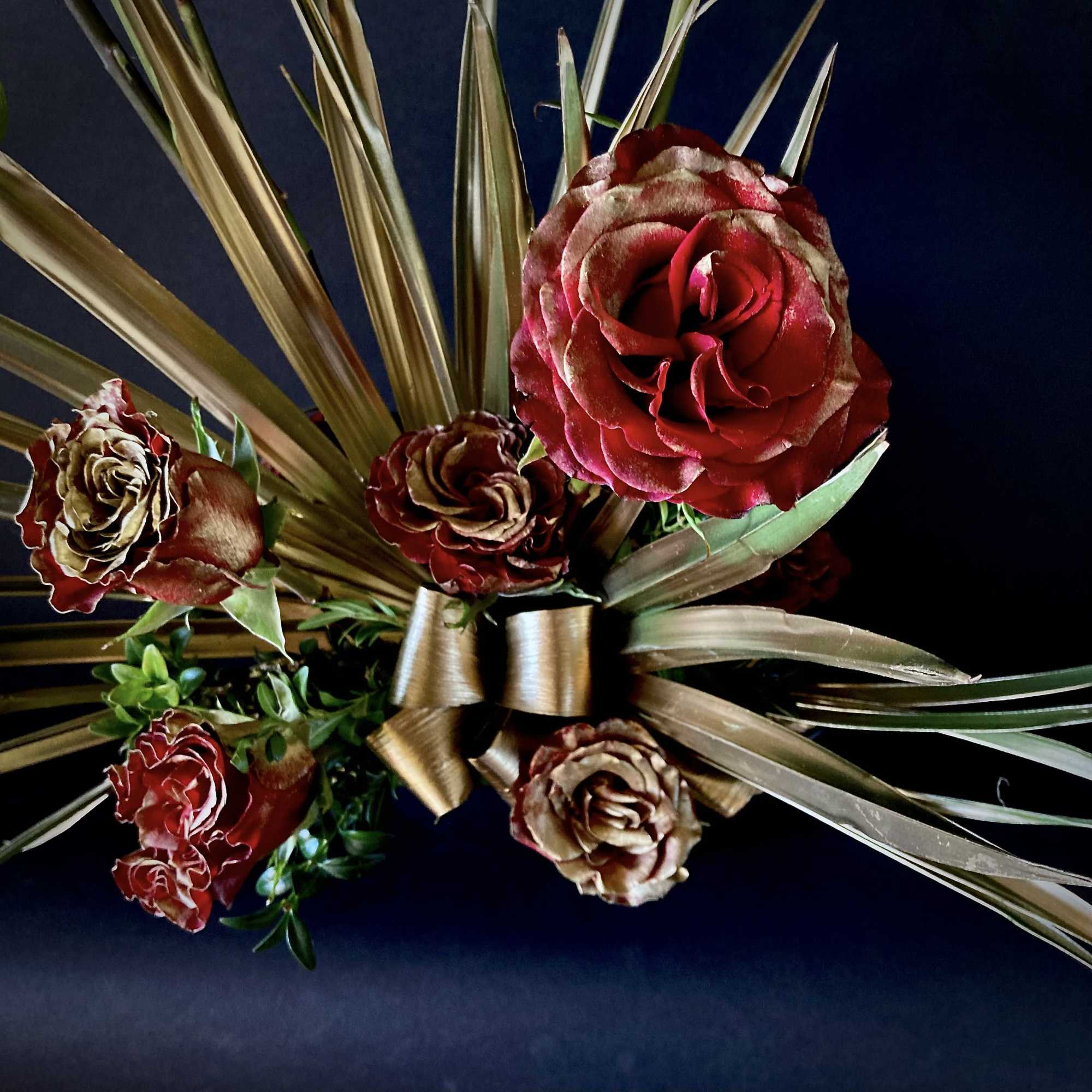 A dozen gilded roses.  