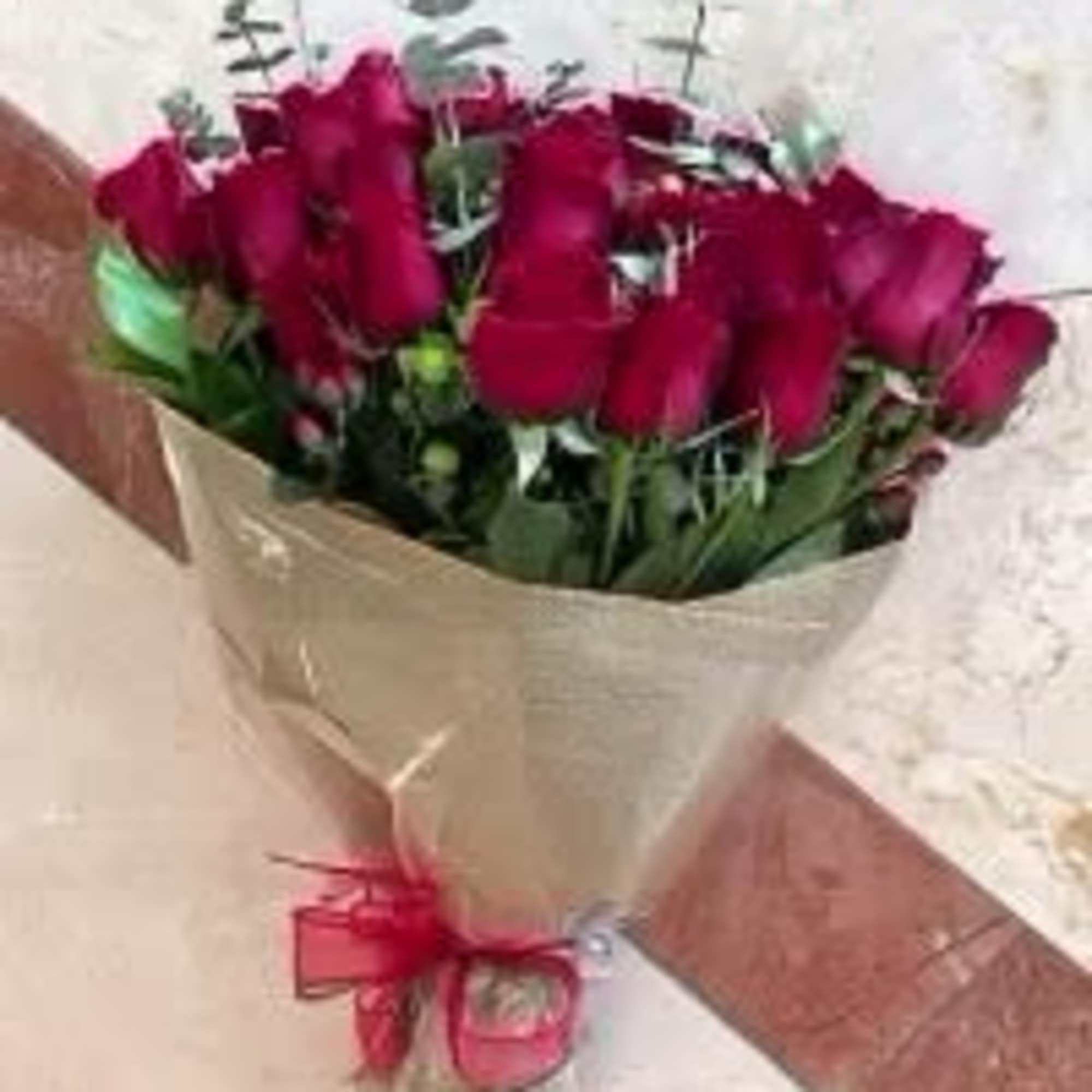 Standard: 12 Red Roses Long Stem Arranged in Wrap Bouquet.
Premium: 24 Red