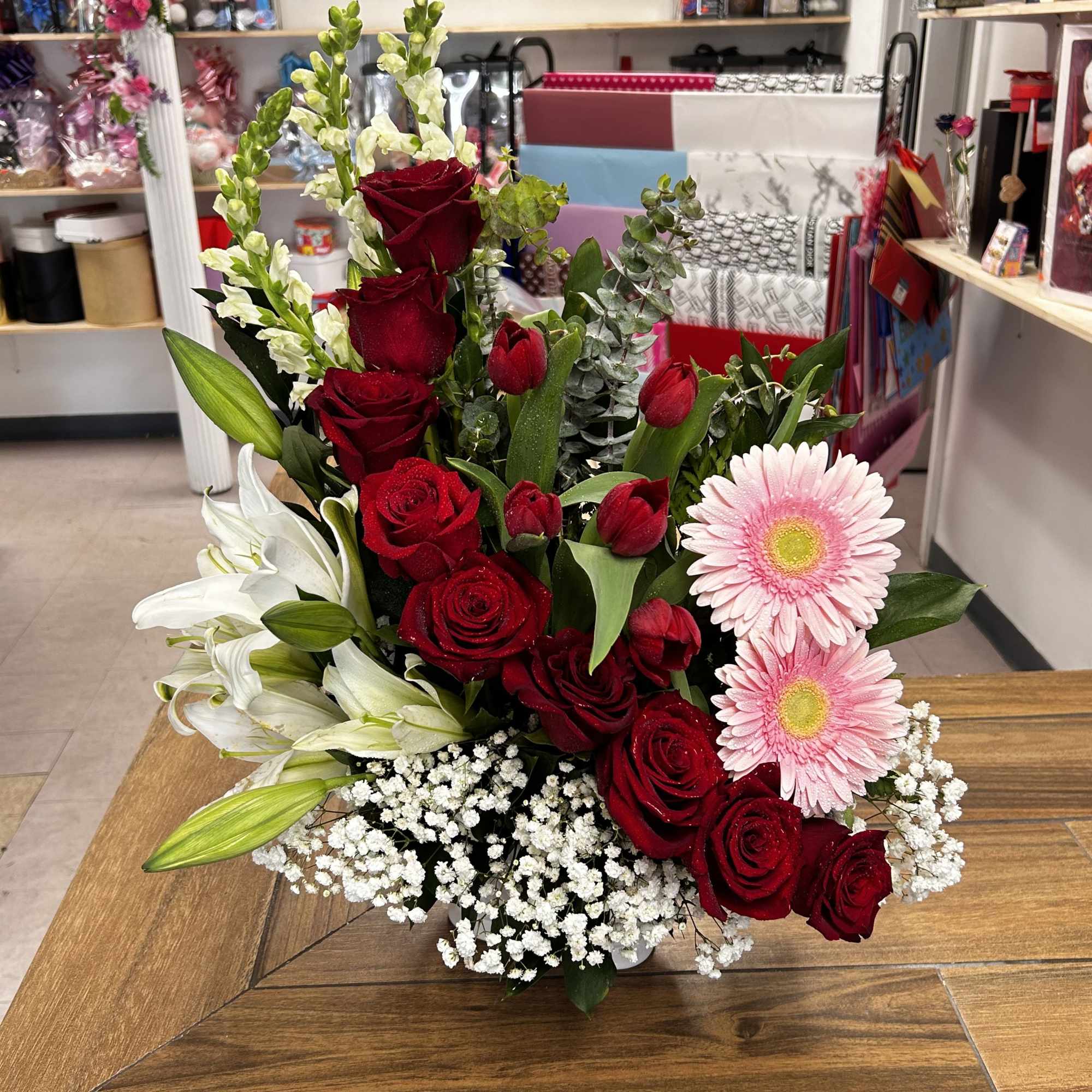 Surprise that special person with this beautiful  floral arrangement, with 9