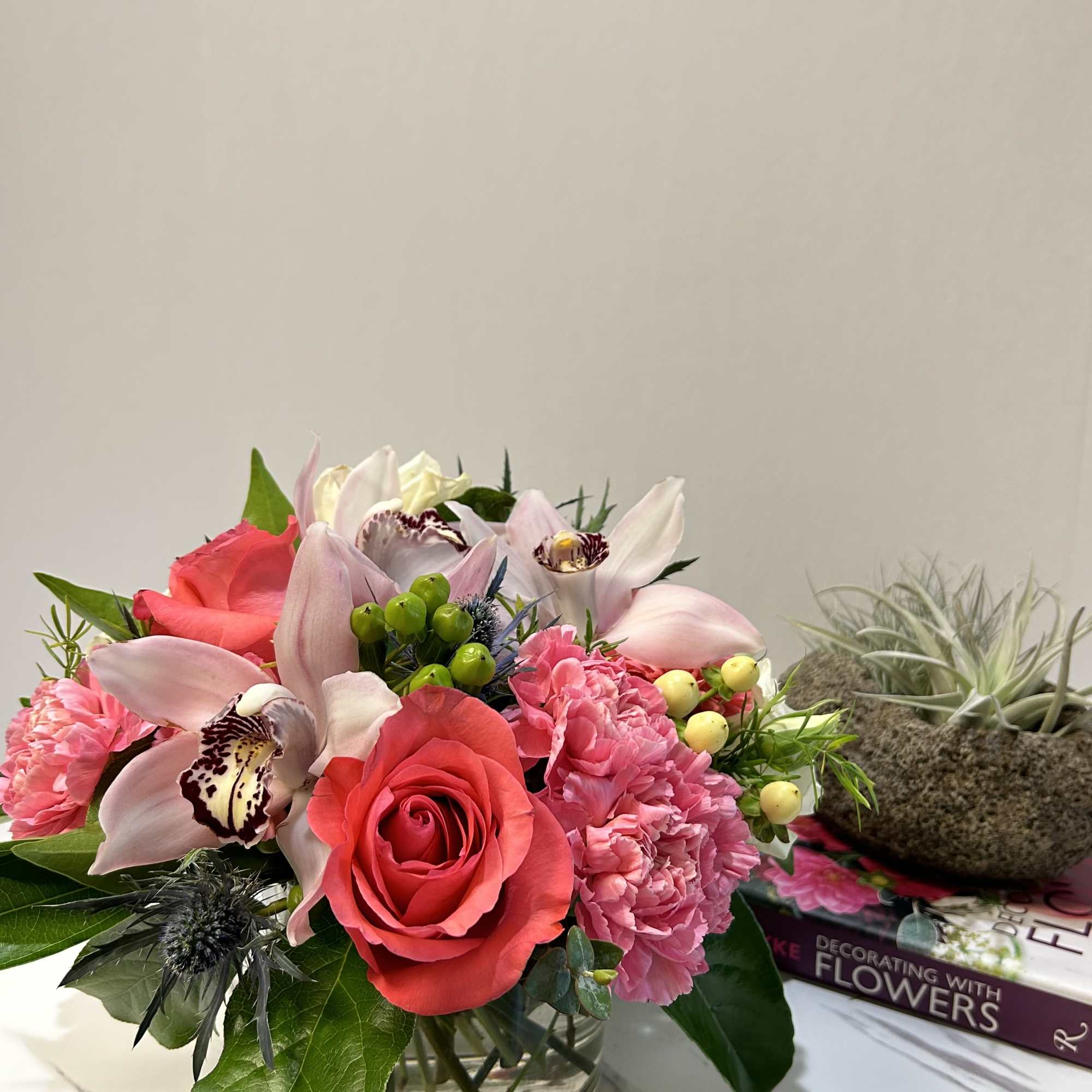 Experience the allure of 'Pretty Pinks,' a beautiful floral arrangement in a Experience the allure of 'Pretty Pinks,' a beautiful floral arrangement in a