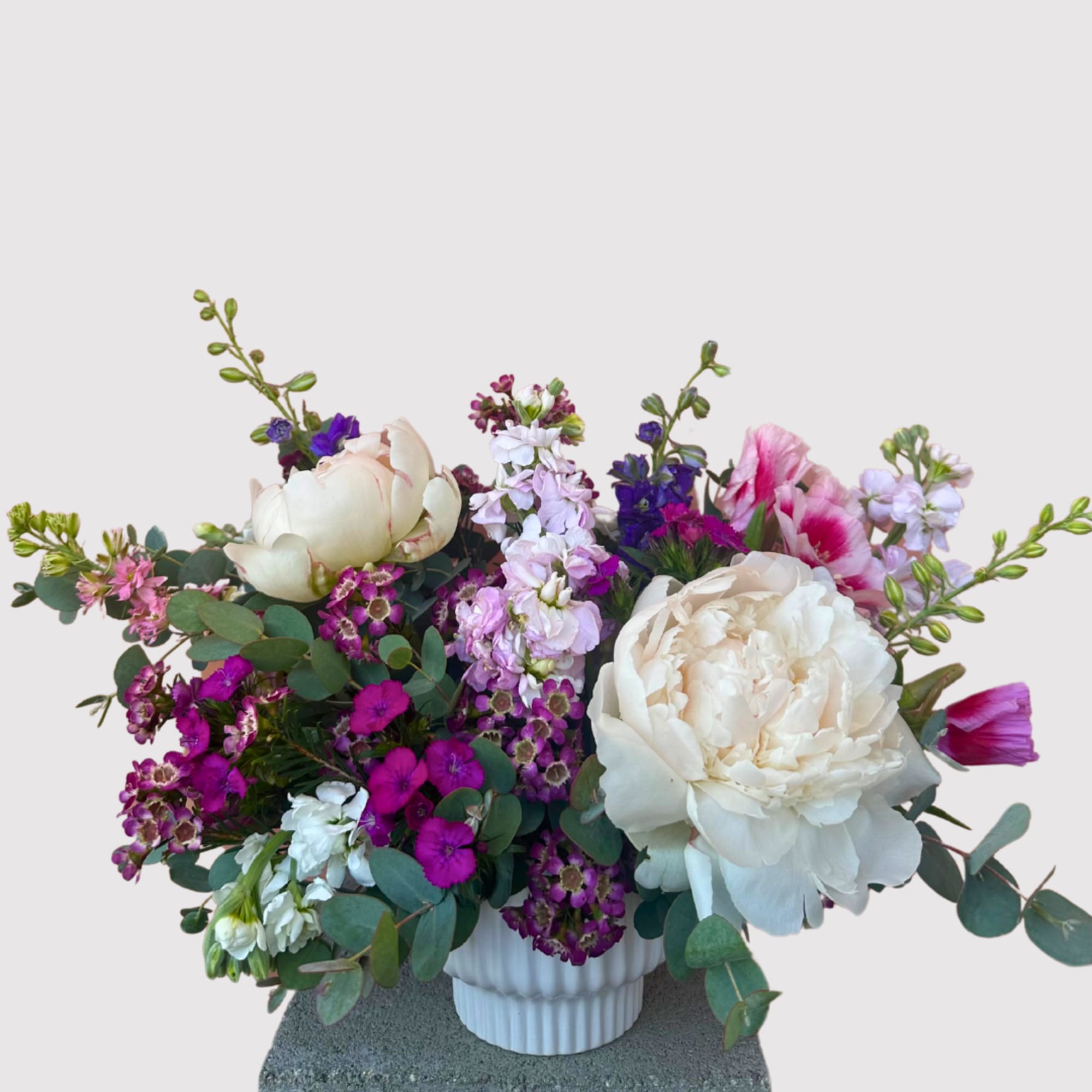 A charming petite arrangement, ideal for small spaces or thoughtful gifts. Locally