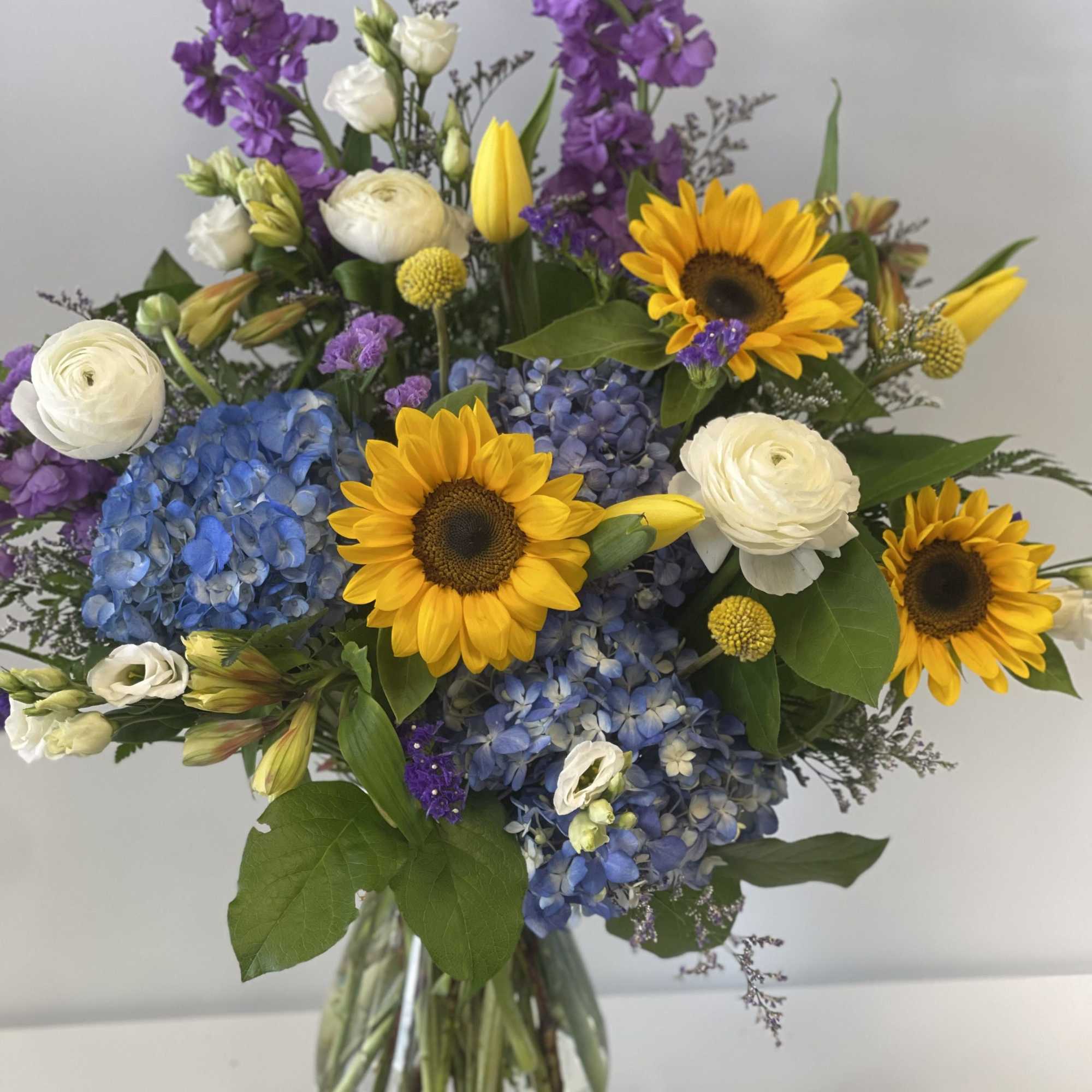 Sunflowers bursting with color in this beautiful arrangement!  Sunflowers bursting with color in this beautiful arrangement!