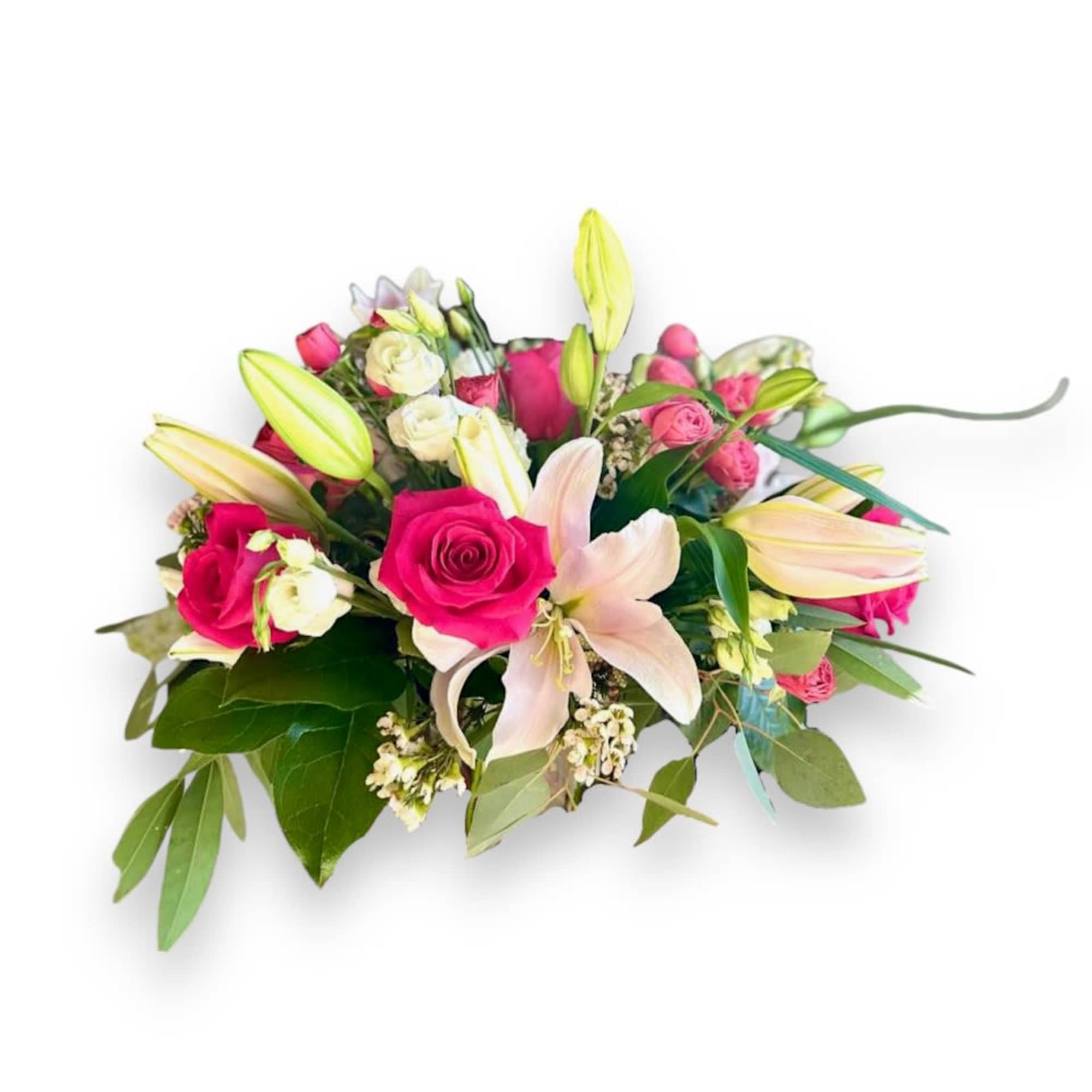 This gorgeous centerpiece showcases hot pink roses, light pink lilies and white