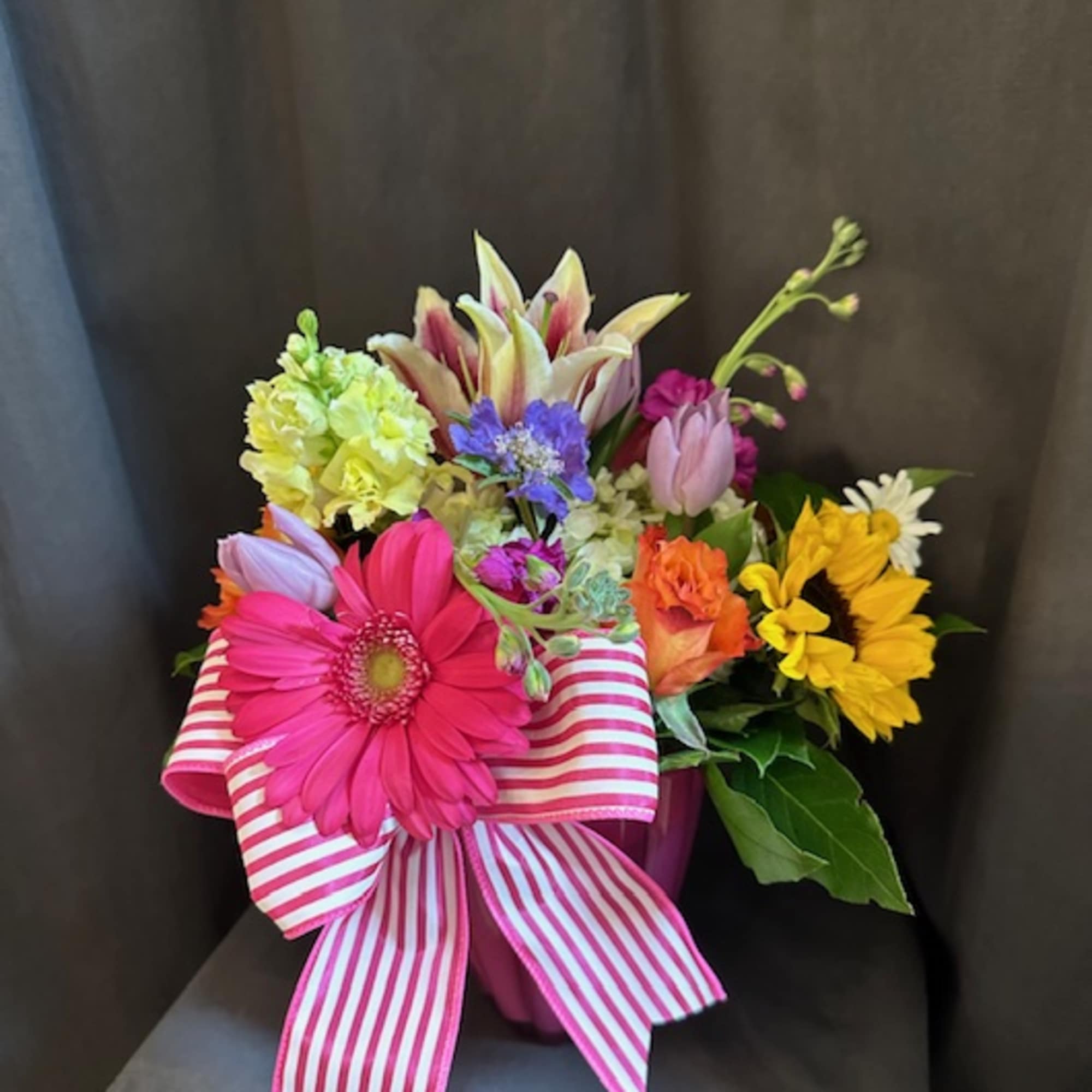 This arrangement will feature an assortment of seasonal flowers in a variety