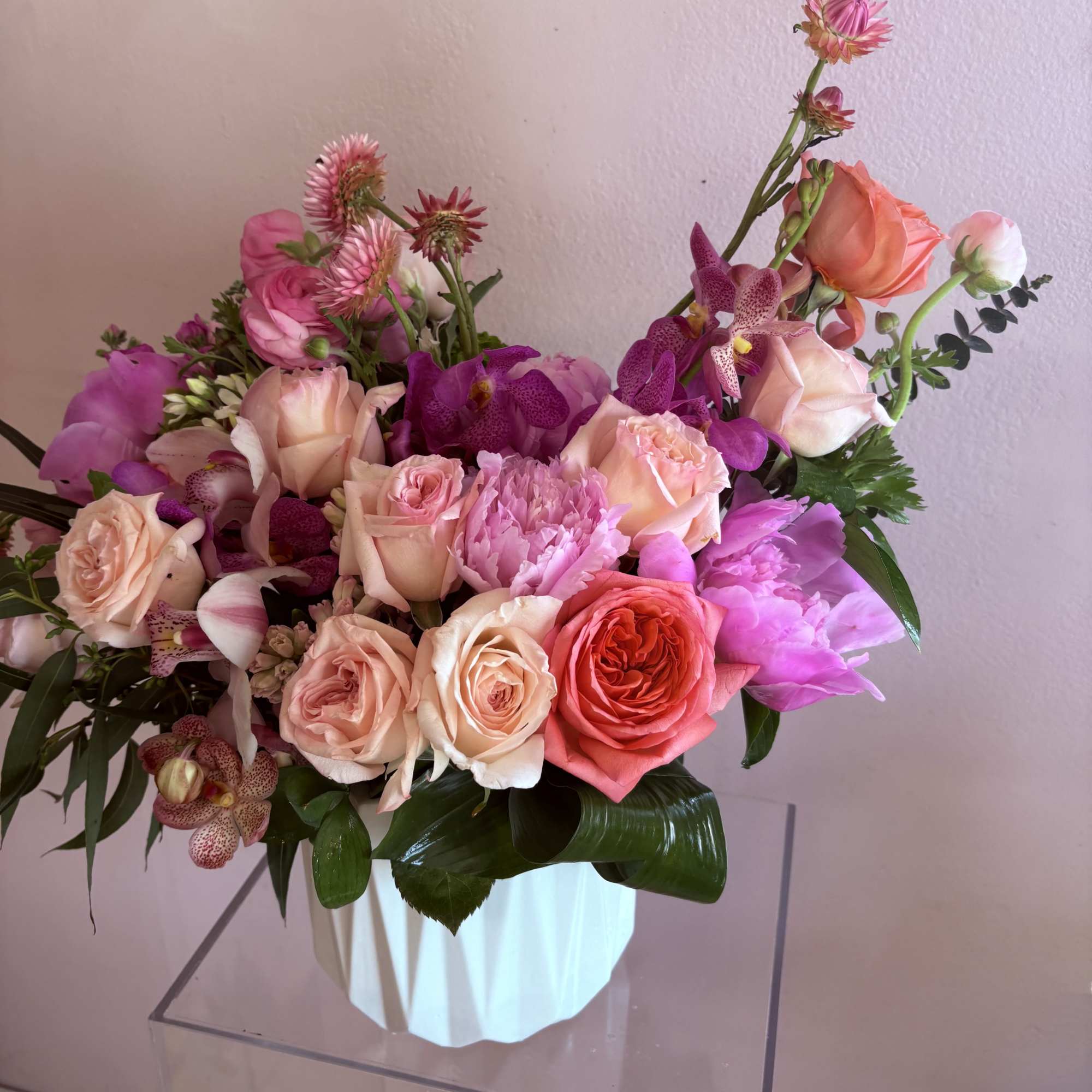Varying shades of pink garden roses, accent with pink peonies, pink mokara