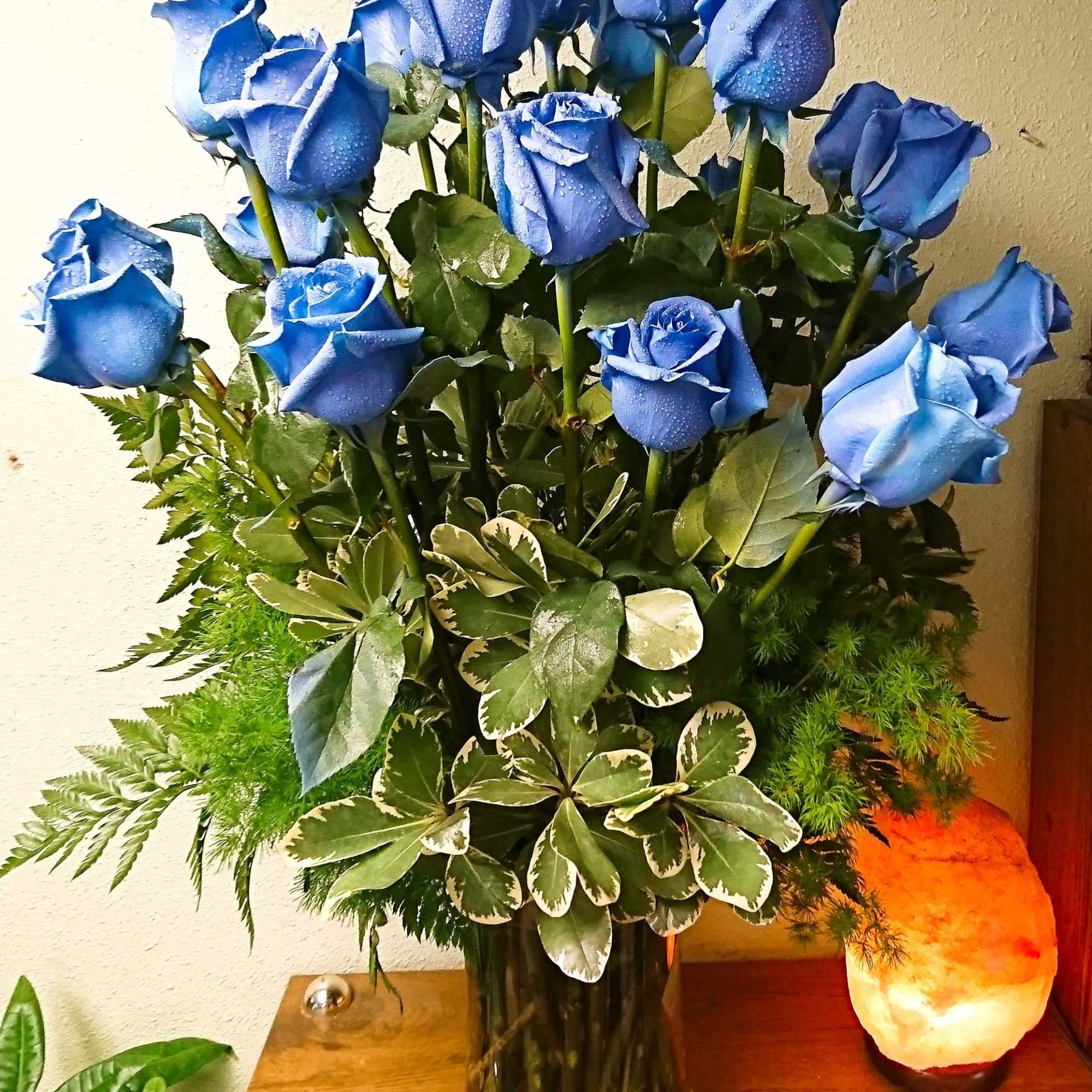 Our Hues of Blue Roses Bouquet features 24 long-stem Ecuadorian roses, custom-tinted