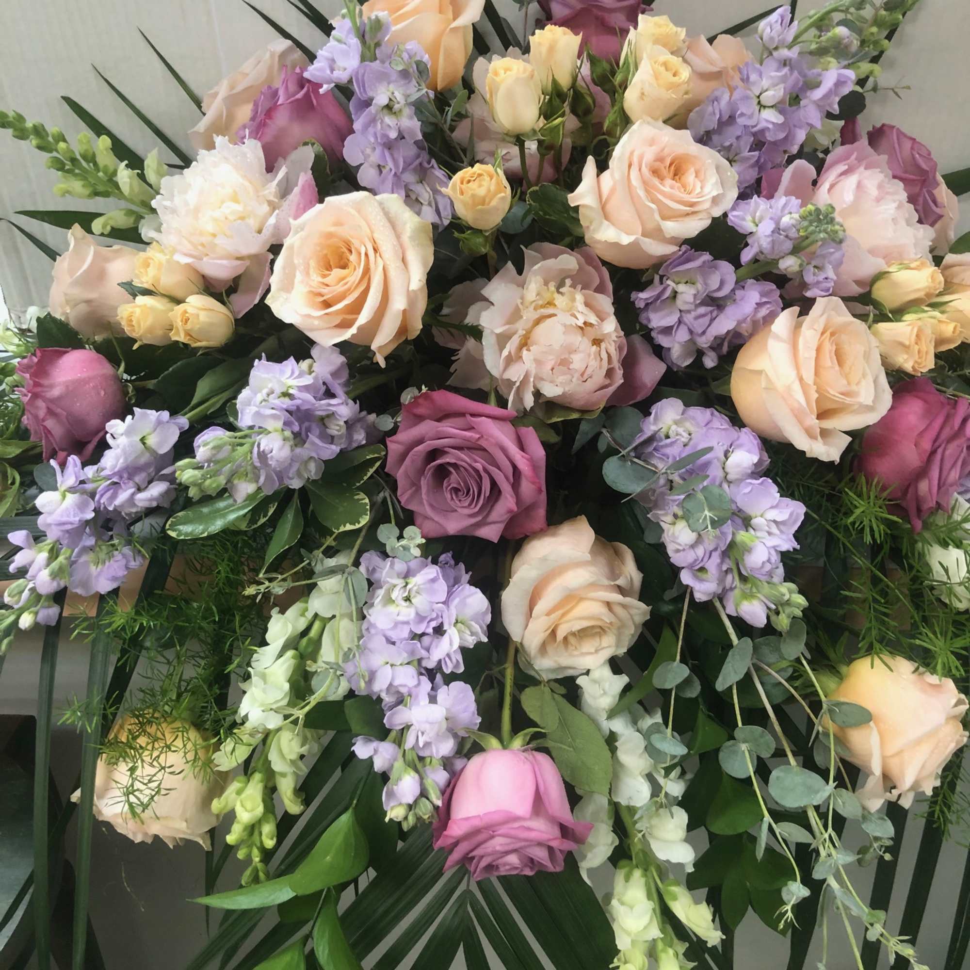 Assorted Roses,  Assorted Stock, Snapdragons, Spray Roses,  Palms,  Fancy Assorted Roses,  Assorted Stock, Snapdragons, Spray Roses,  Palms,  Fancy