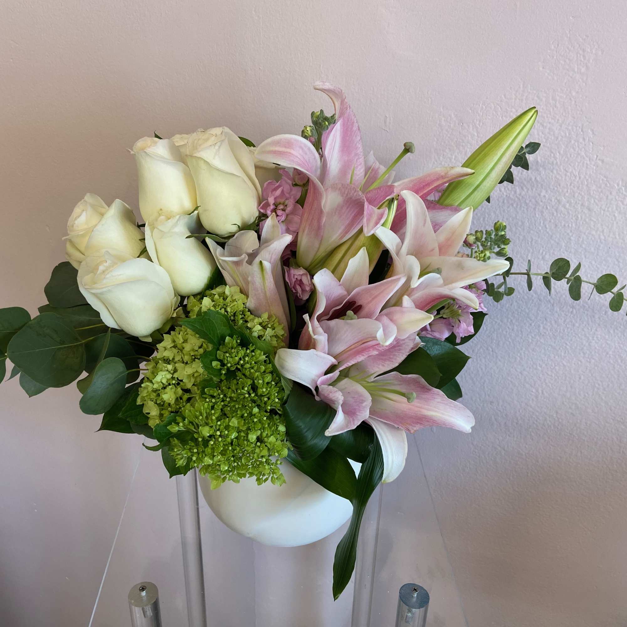 A half dozen white roses and a beautiful bunch of pink lilies