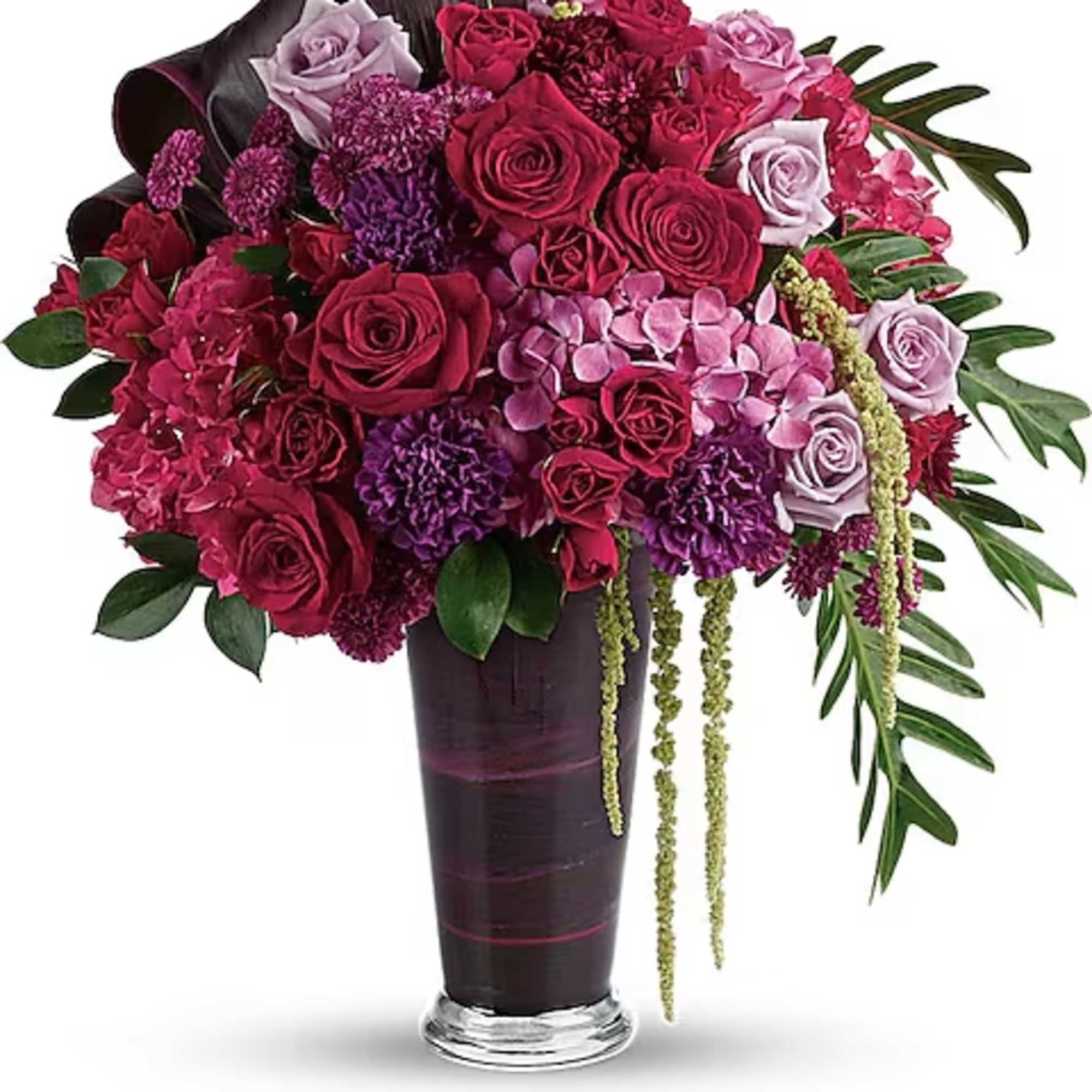 A dramatic display in jewel-toned roses and hydrangea in a sophisticated vase