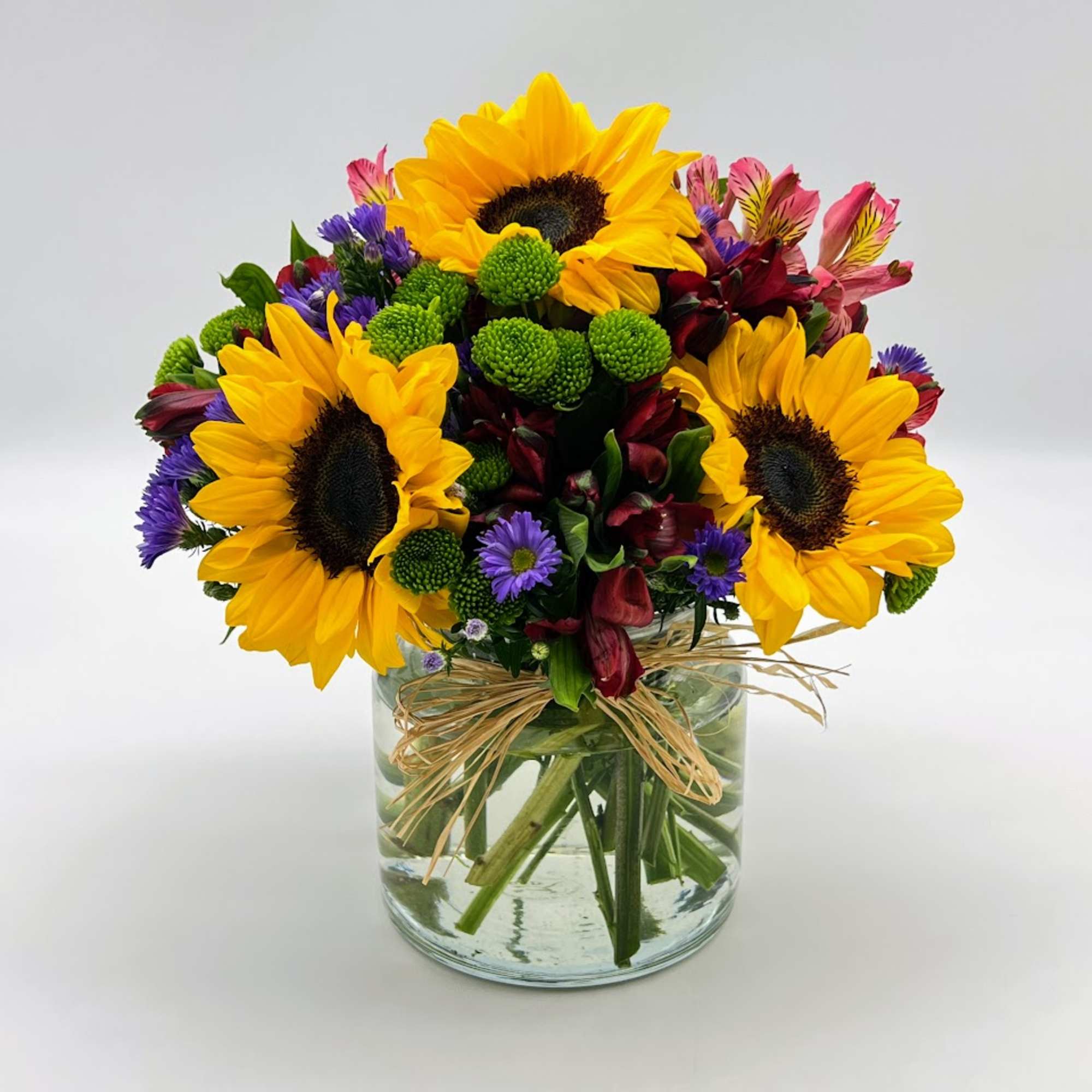 Reminiscent of strolling through a field of flowers, this colorful arrangement captures Reminiscent of strolling through a field of flowers, this colorful arrangement captures