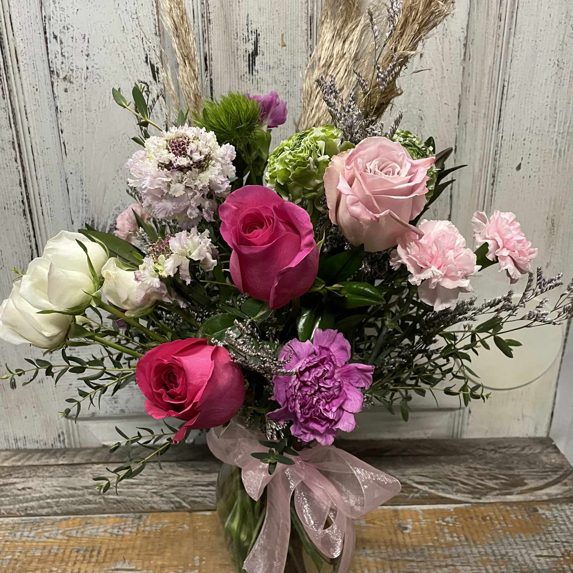 Simple with fun colors, arranged with warm love inside a clear vase.
Shades